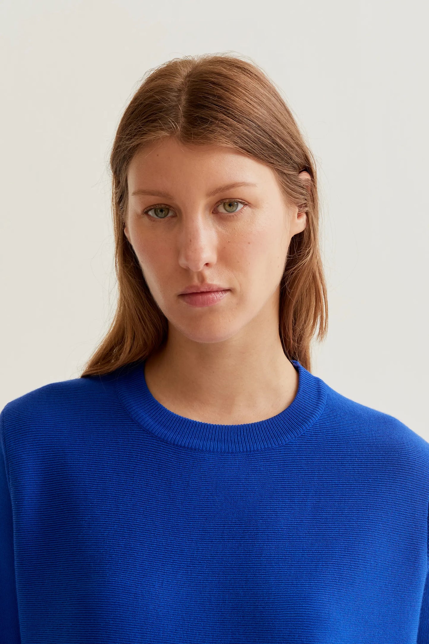 long-sleeved blue knit sweater