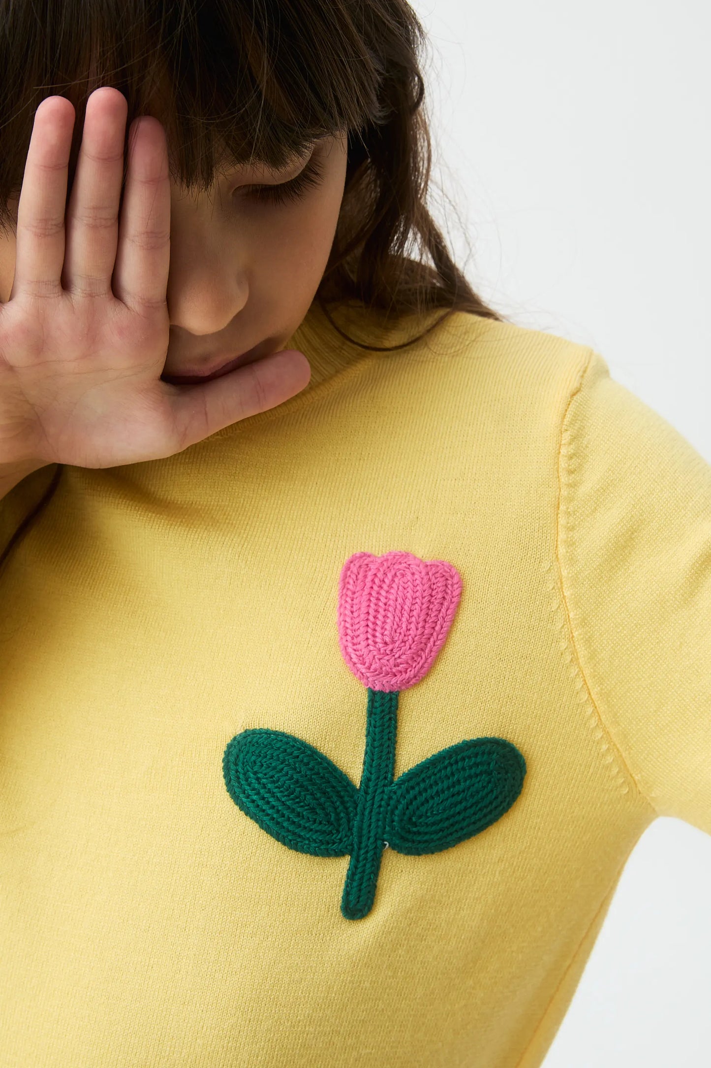 Girl's knitted sweater with flower embroidery