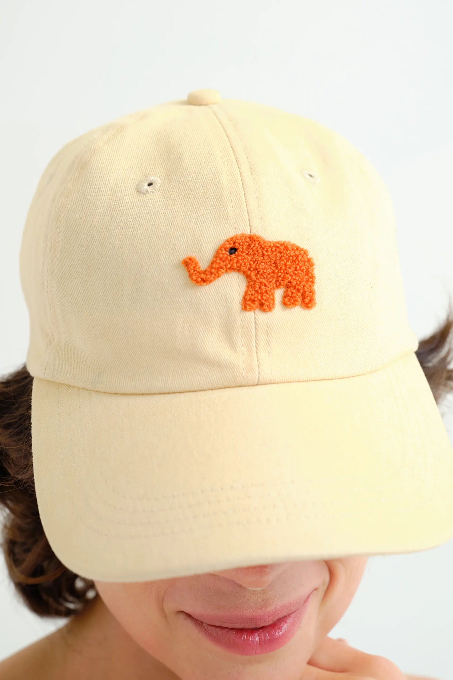 Beige cap with red elephant embroidery