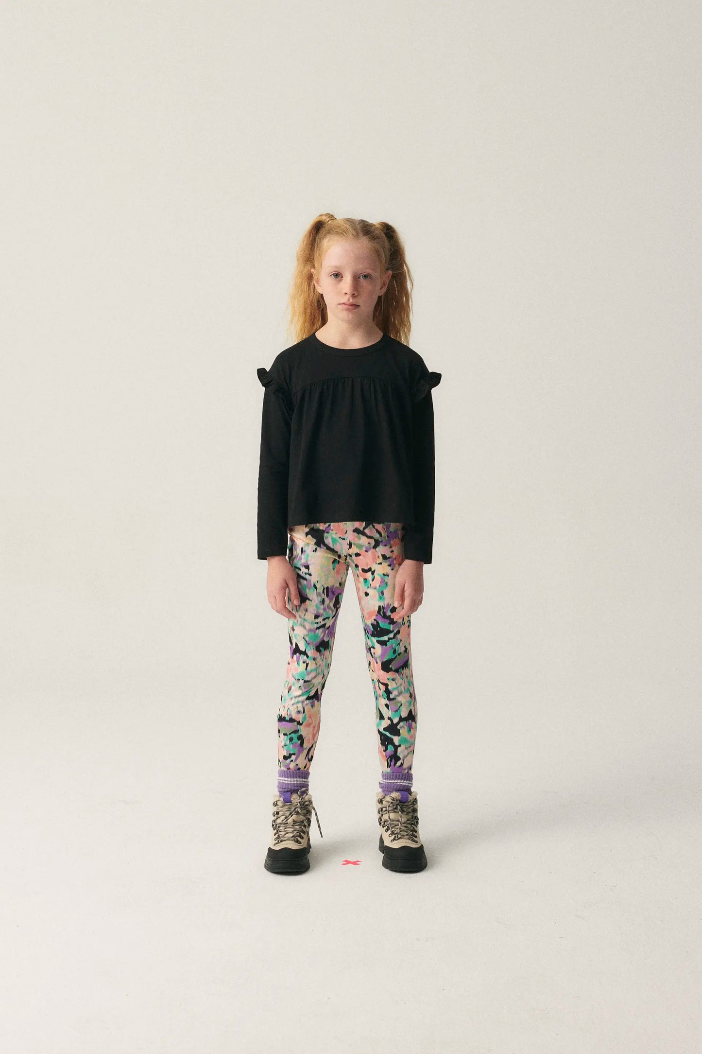Girl's top with black ruffles
