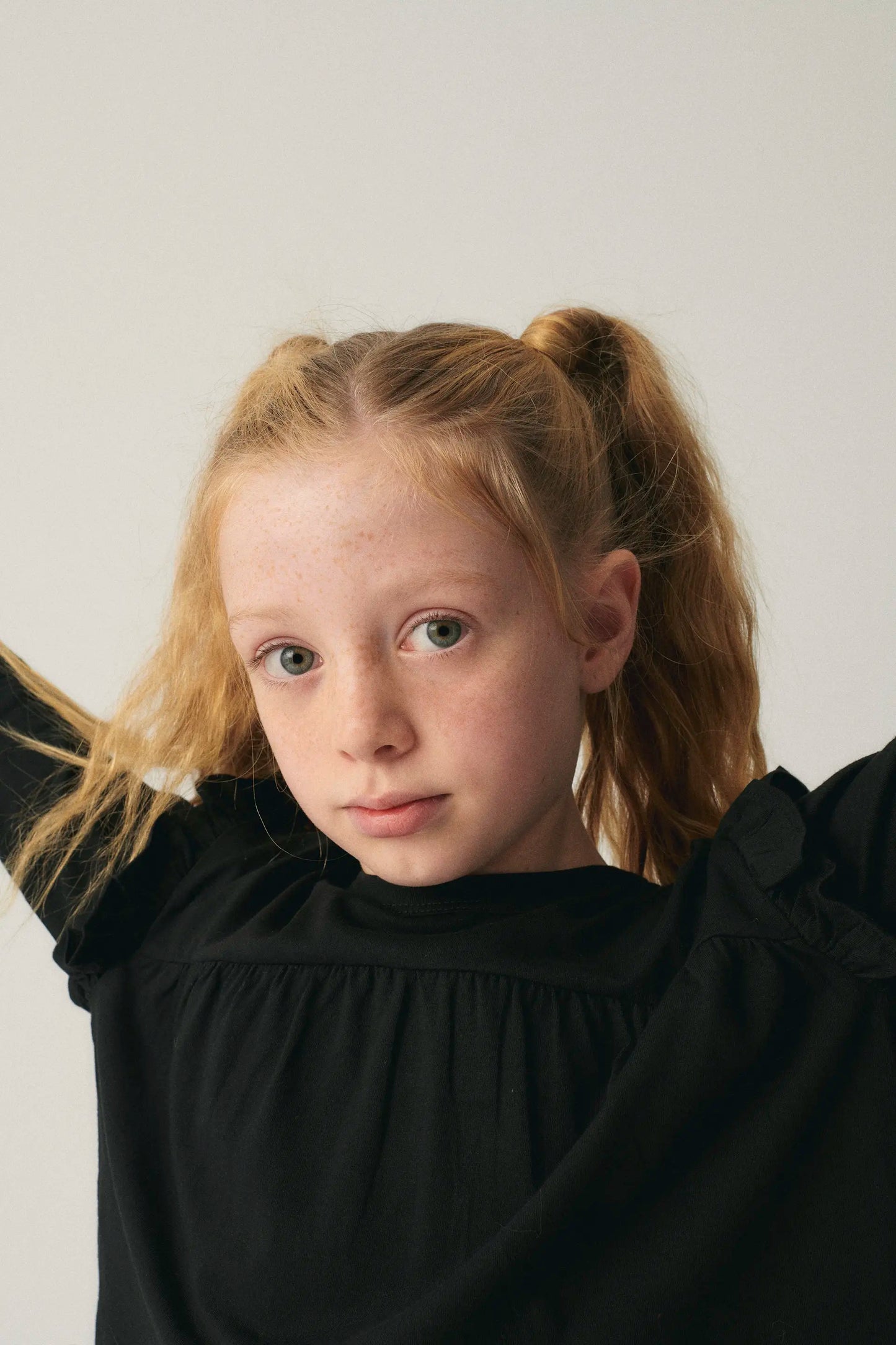 Girl's top with black ruffles