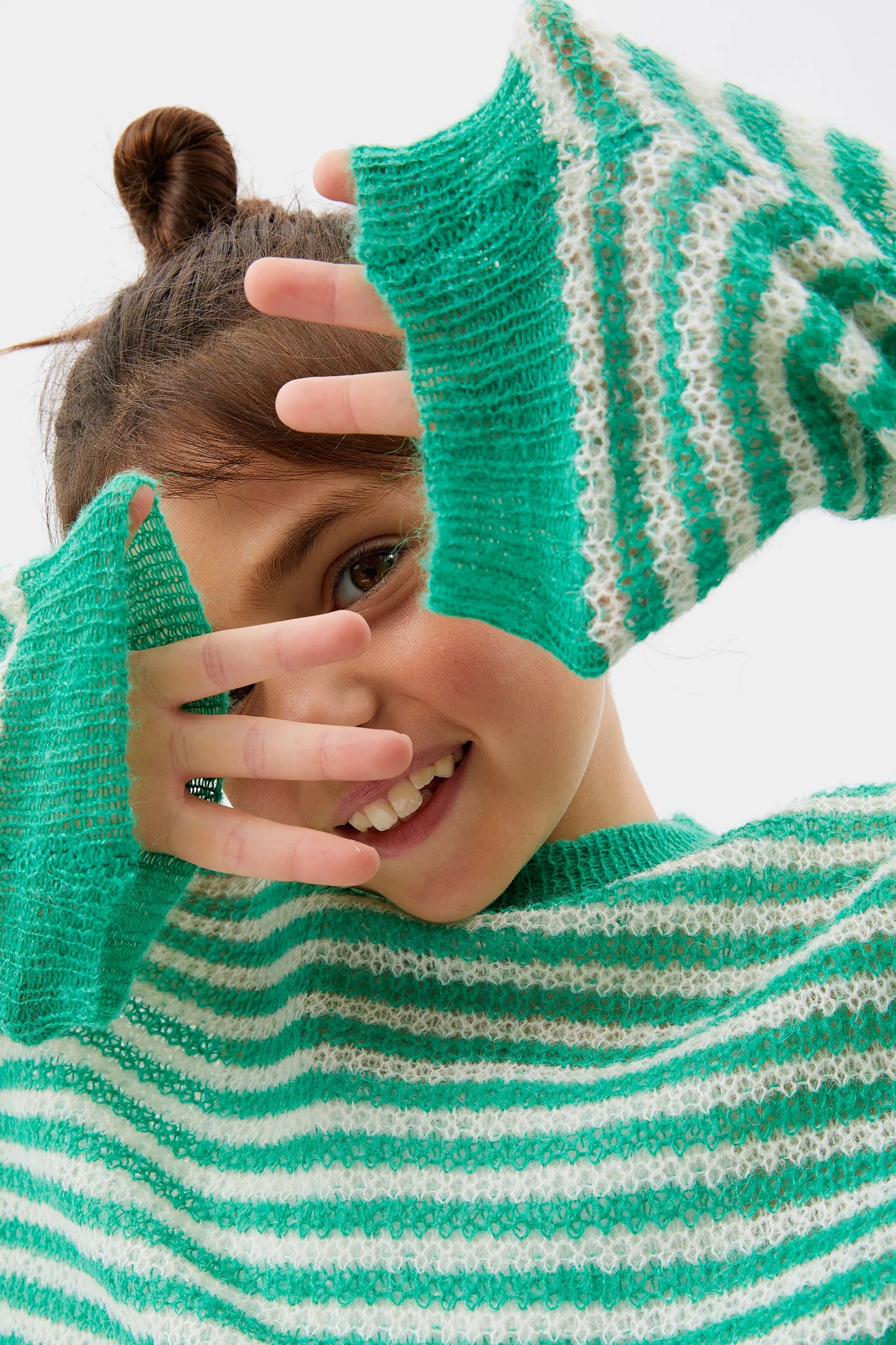 Girl's green striped cable knit sweater