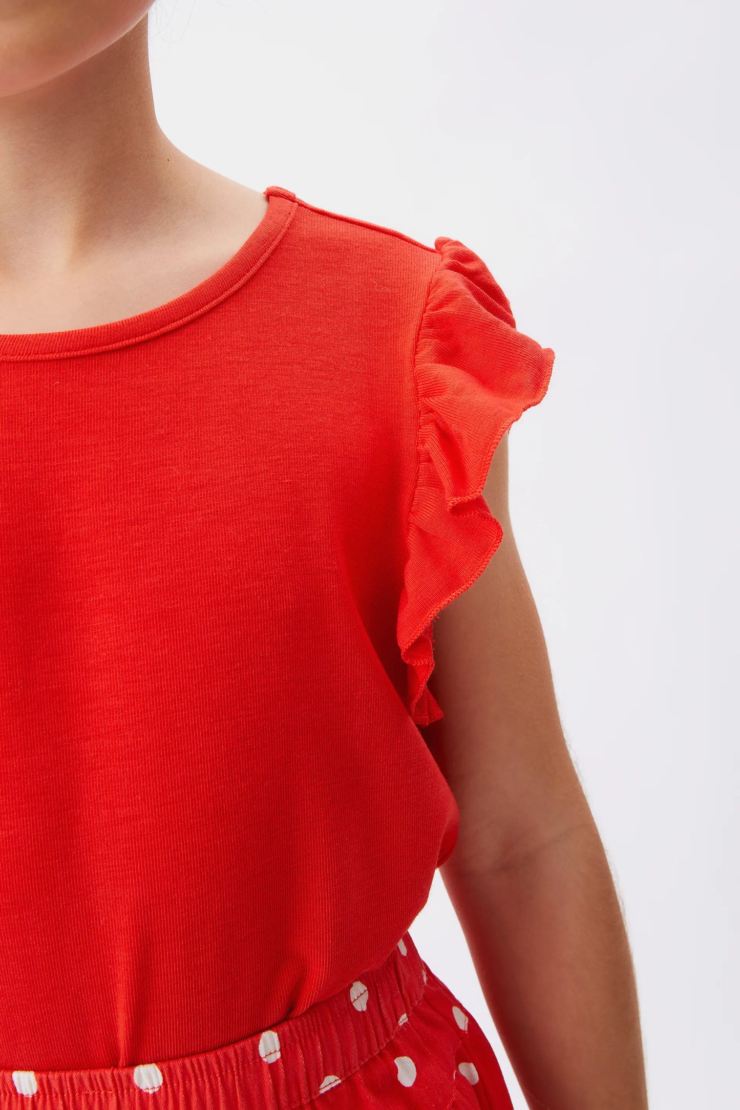 Top da bambina con volant rossi