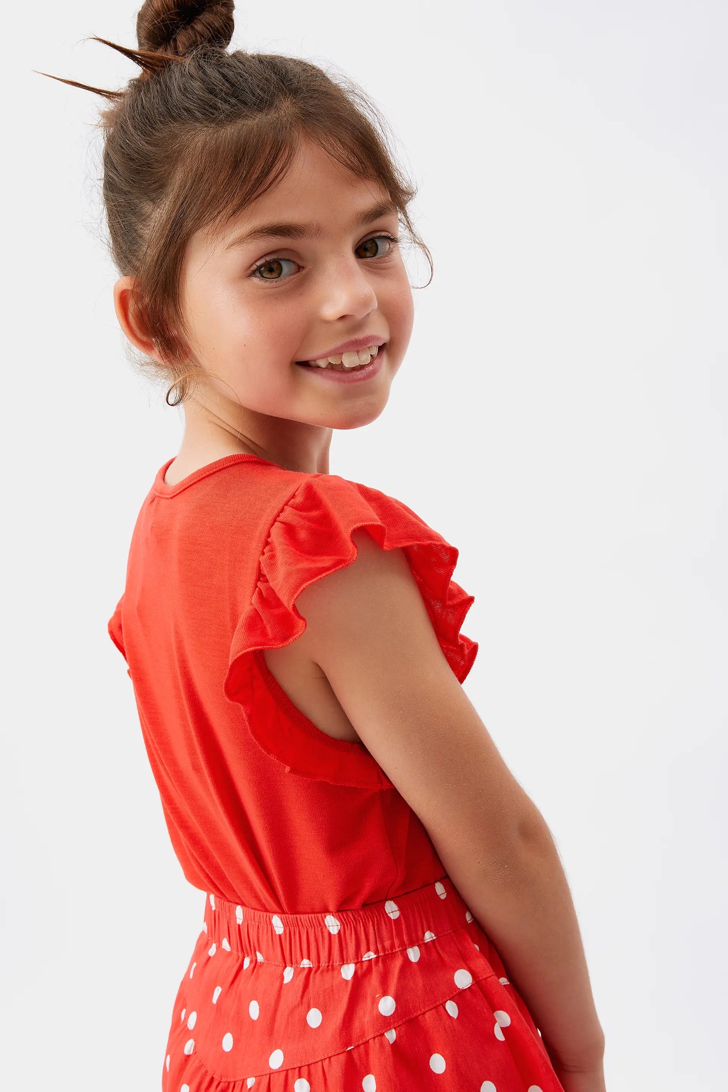 Top da bambina con volant rossi