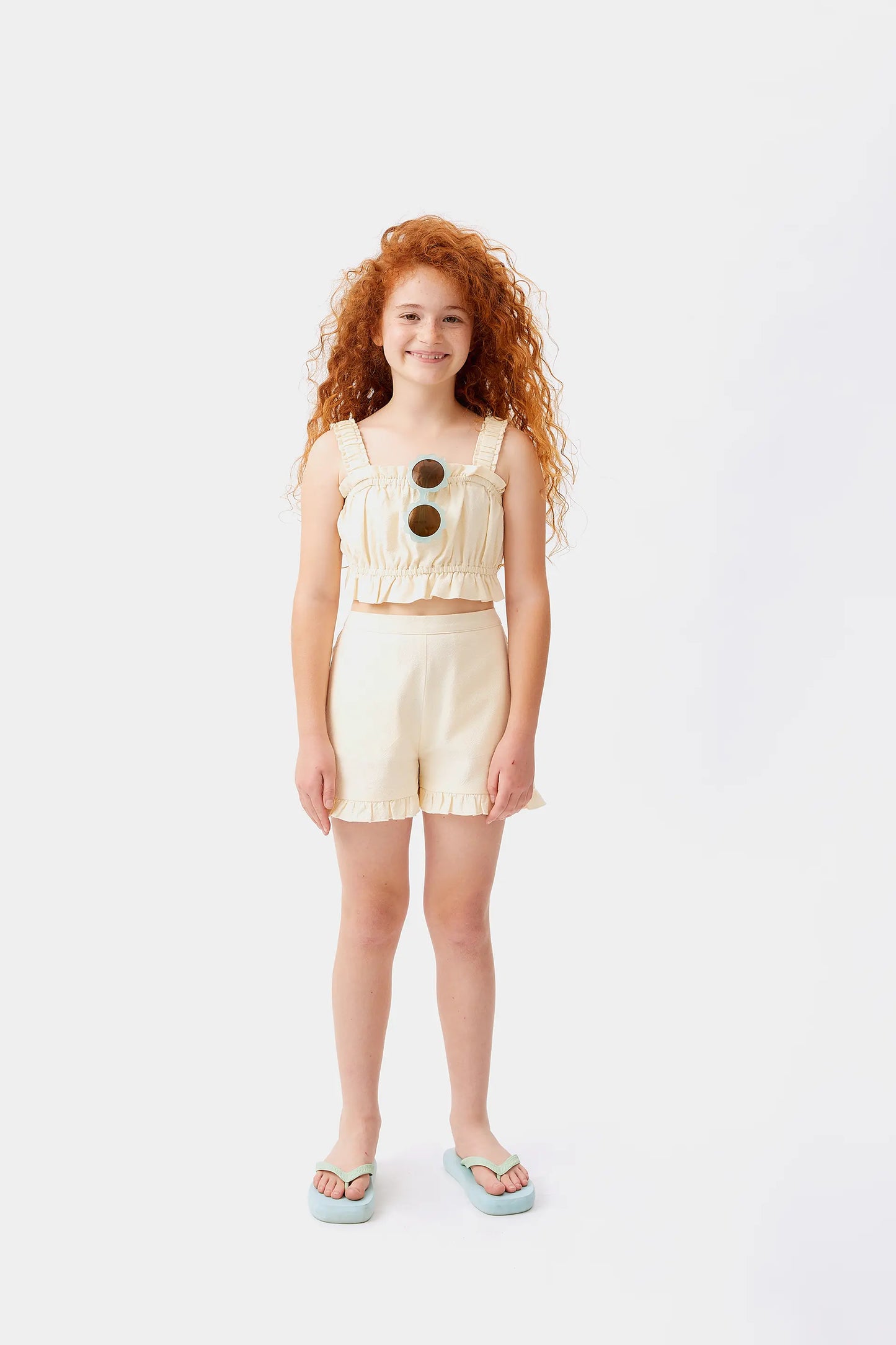 Top corto bianco da bambina senza spalline