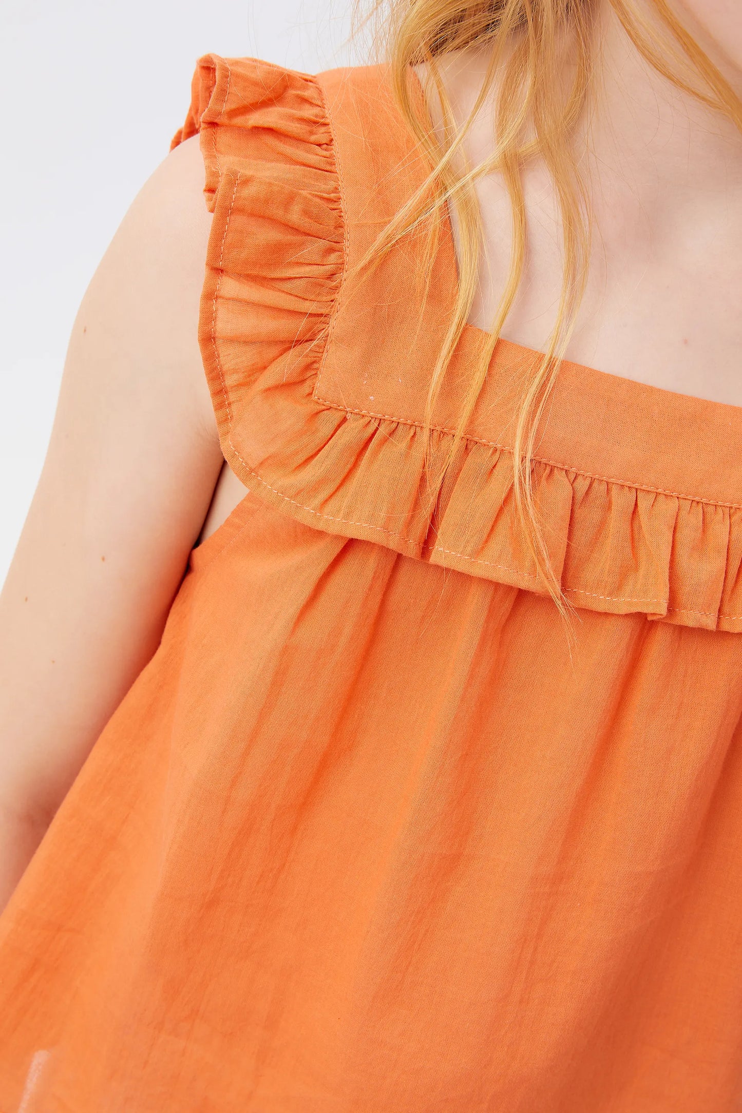 Top de niña volantes naranja