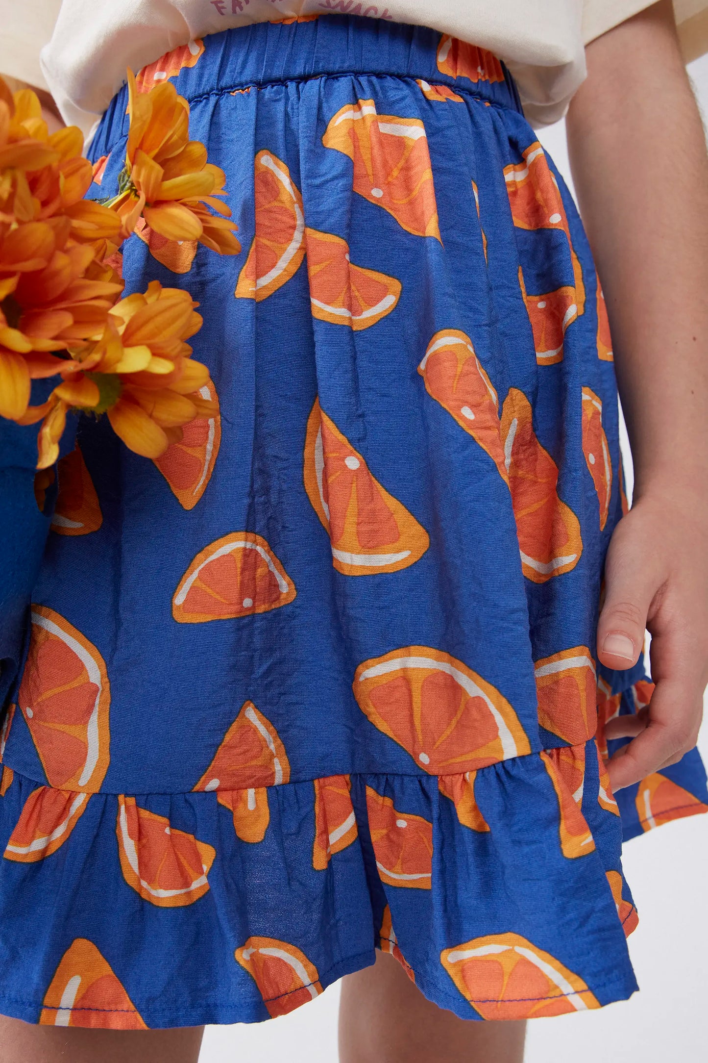 Falda corta de niña estampado pomelos