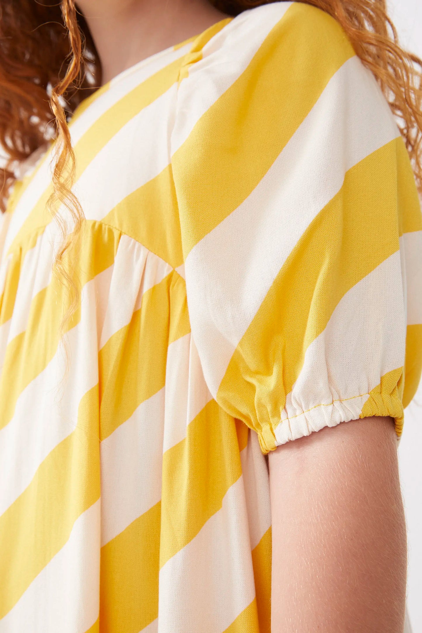 Short dress for girls with yellow striped print
