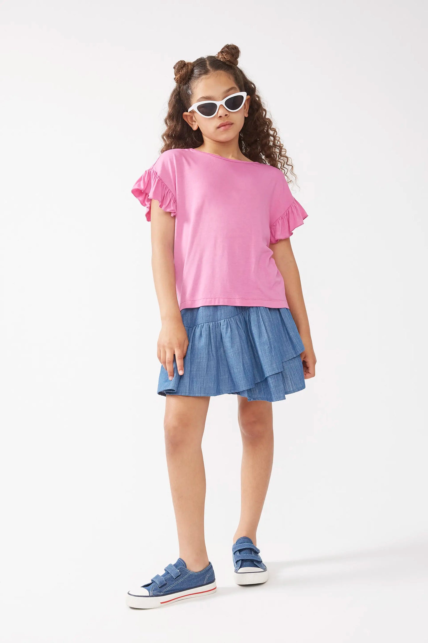 Top rosa con volant per bambina