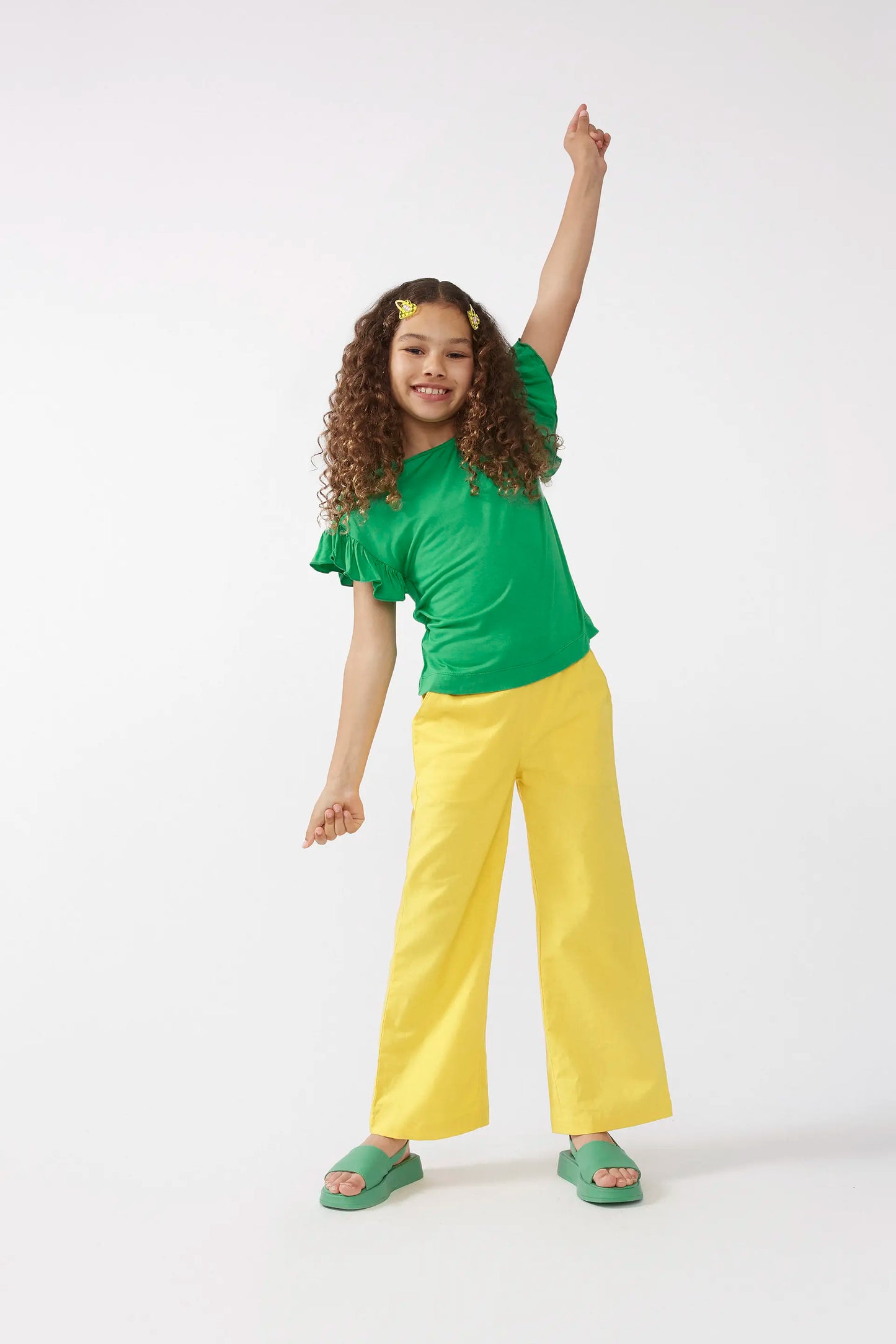 Top da bambina con volant verdi
