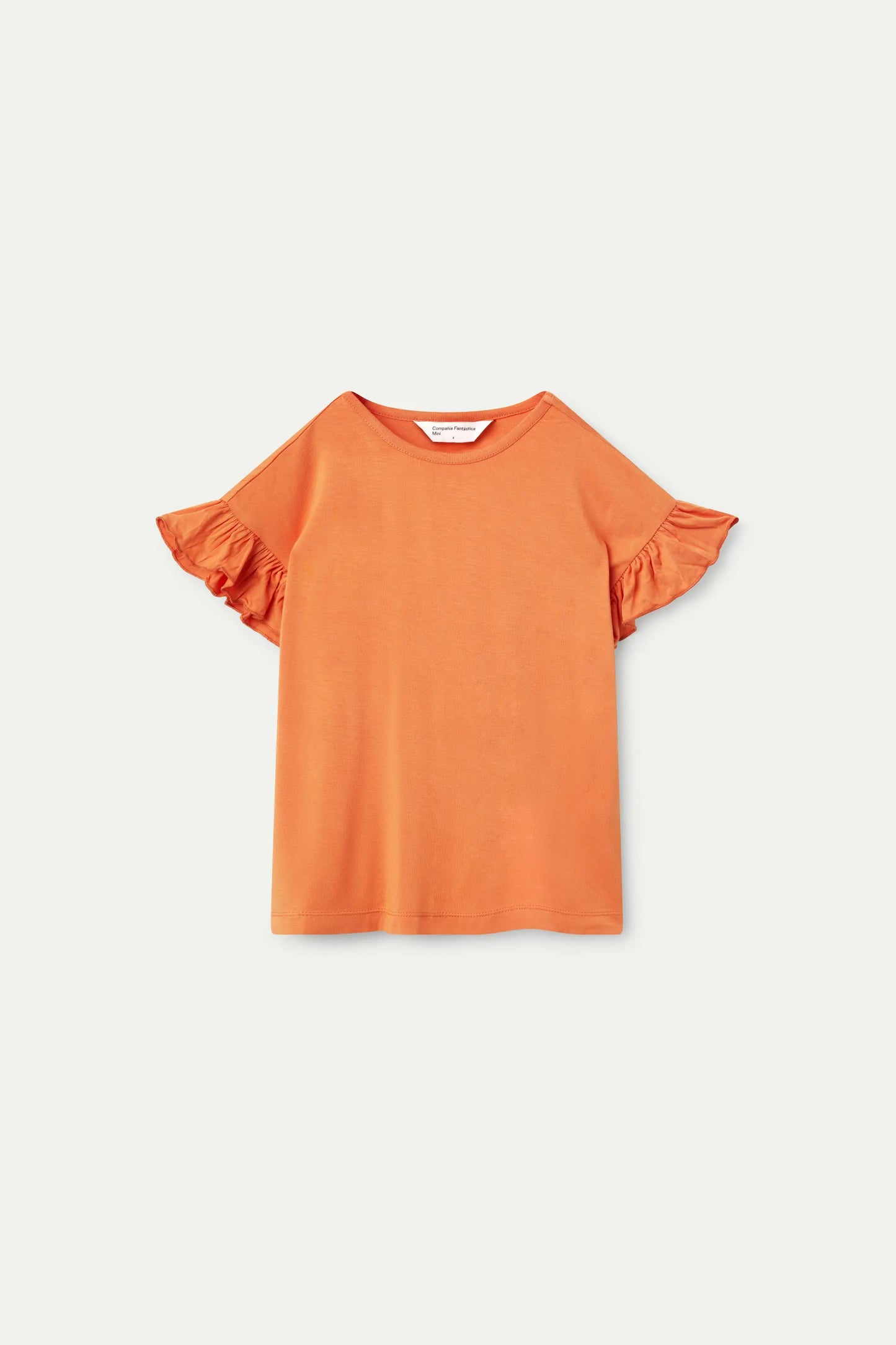 Top arancione con volant da bambina