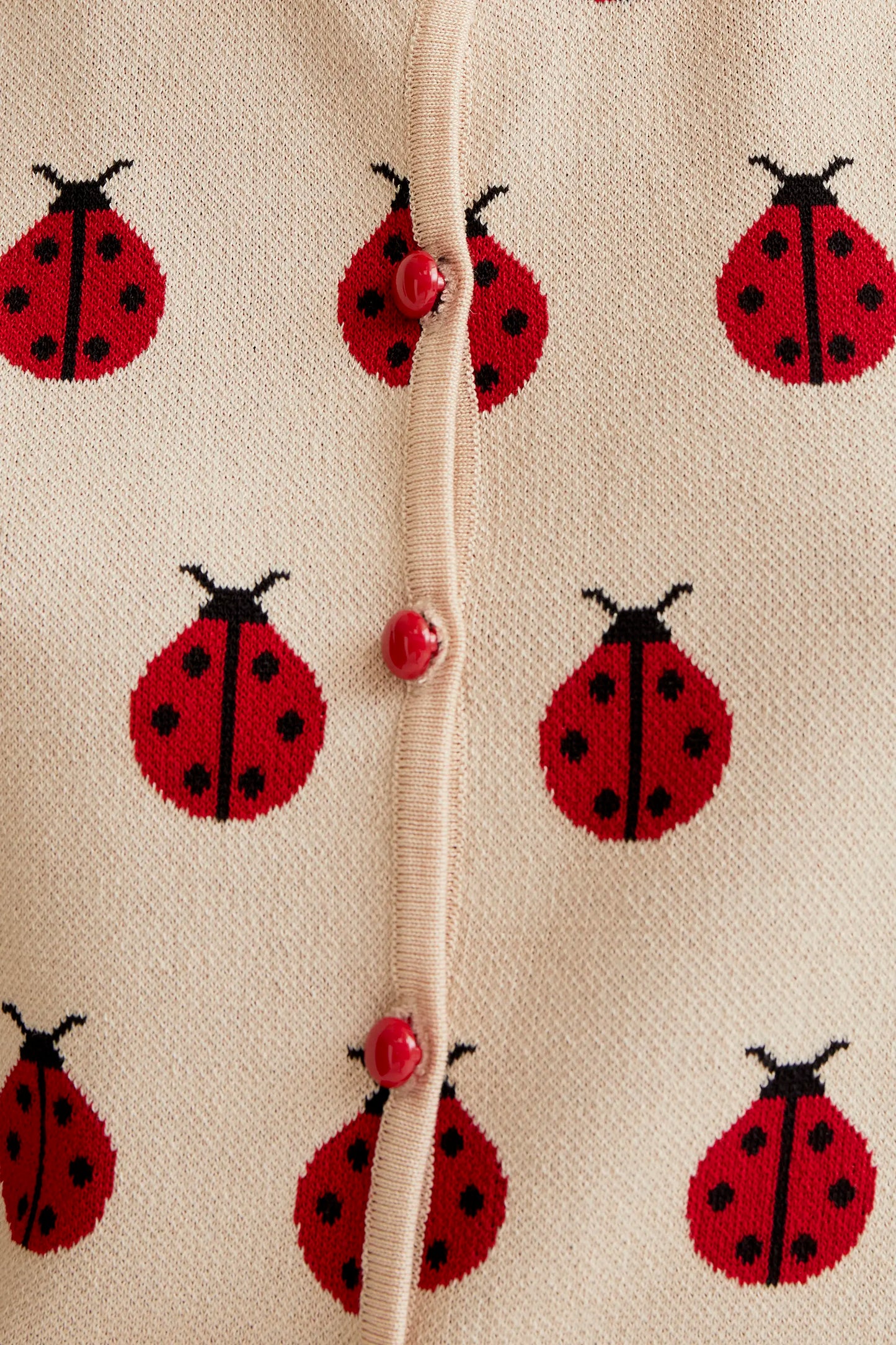 Top in maglia con stampa Coccinella rossa