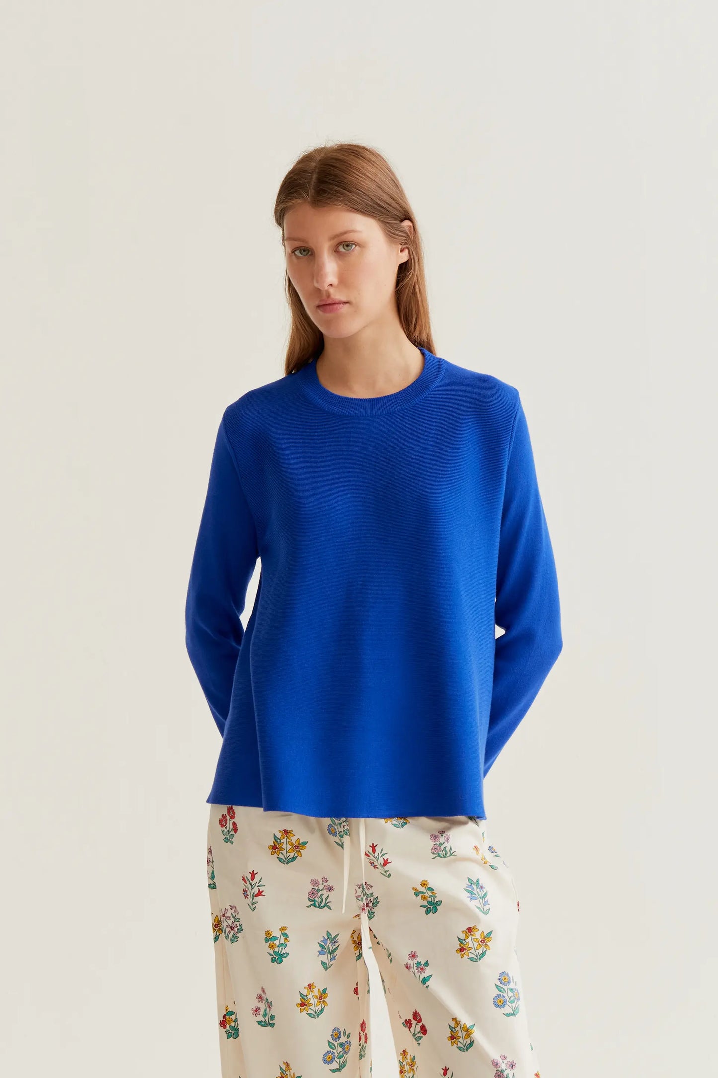 long-sleeved blue knit sweater