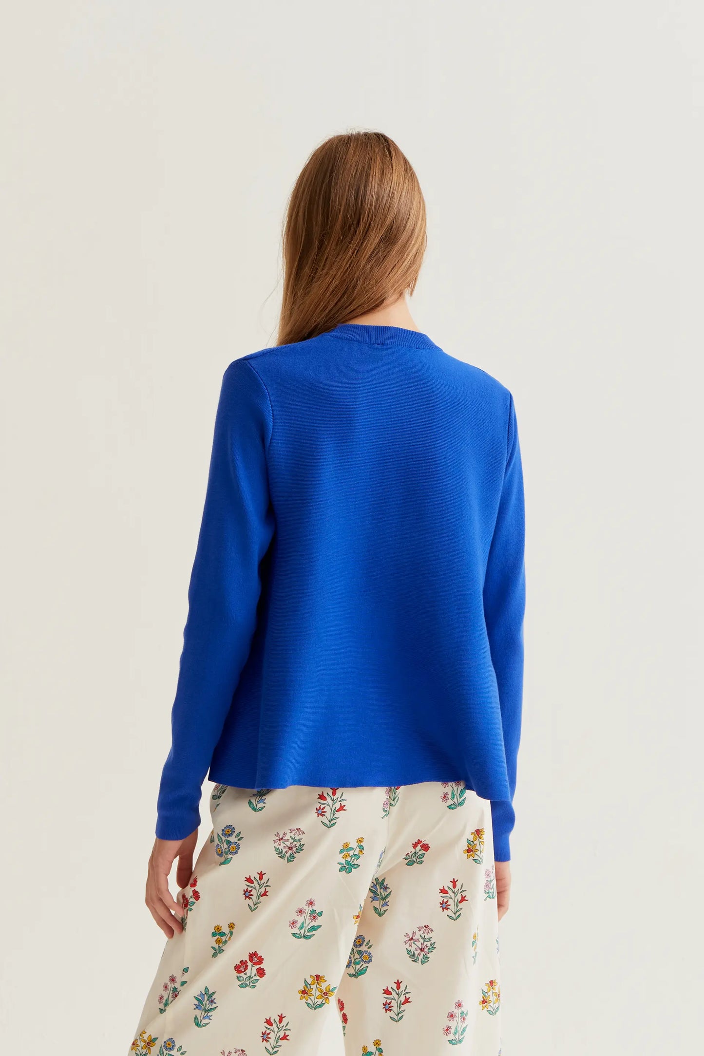 long-sleeved blue knit sweater