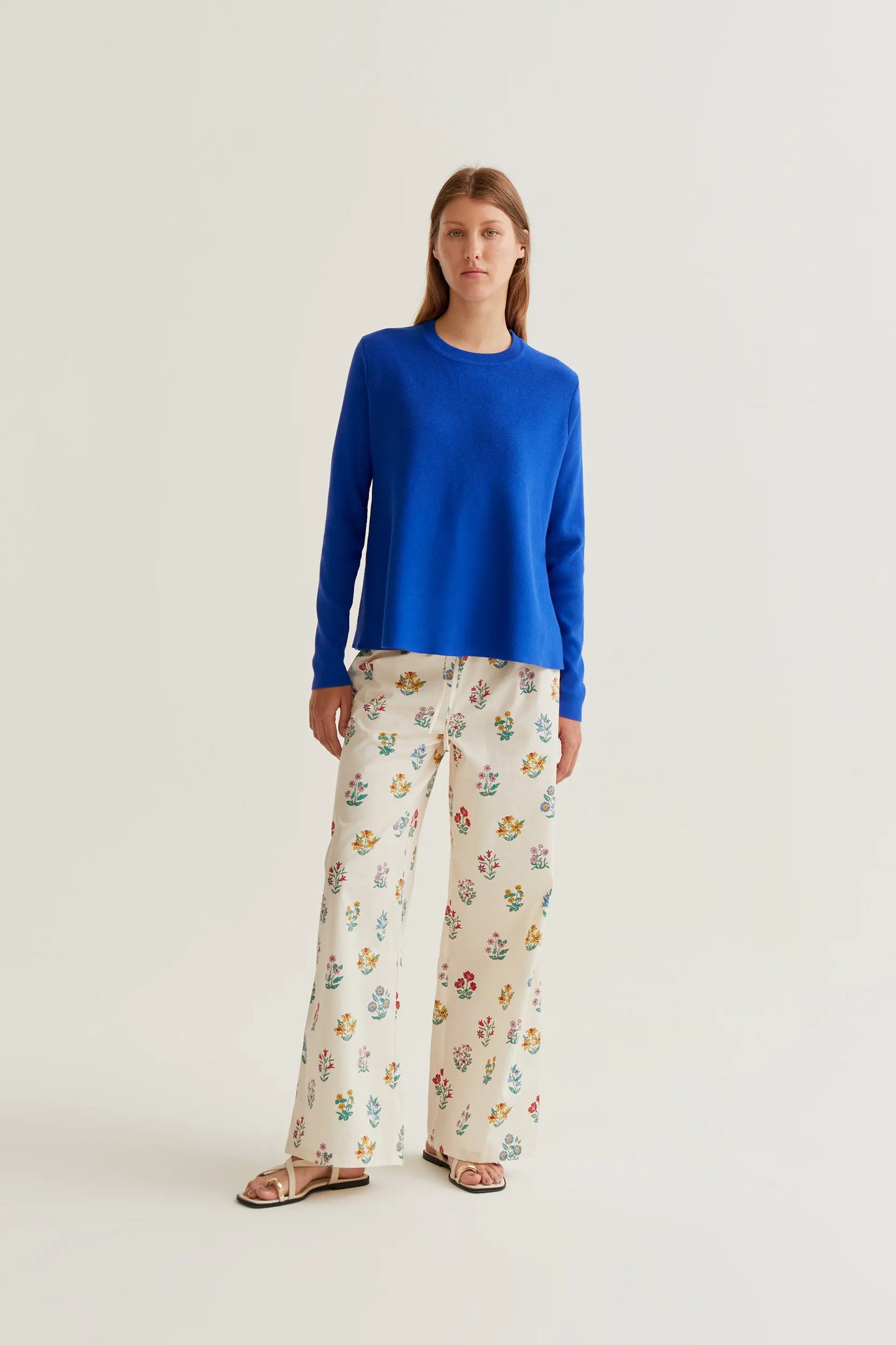 long-sleeved blue knit sweater