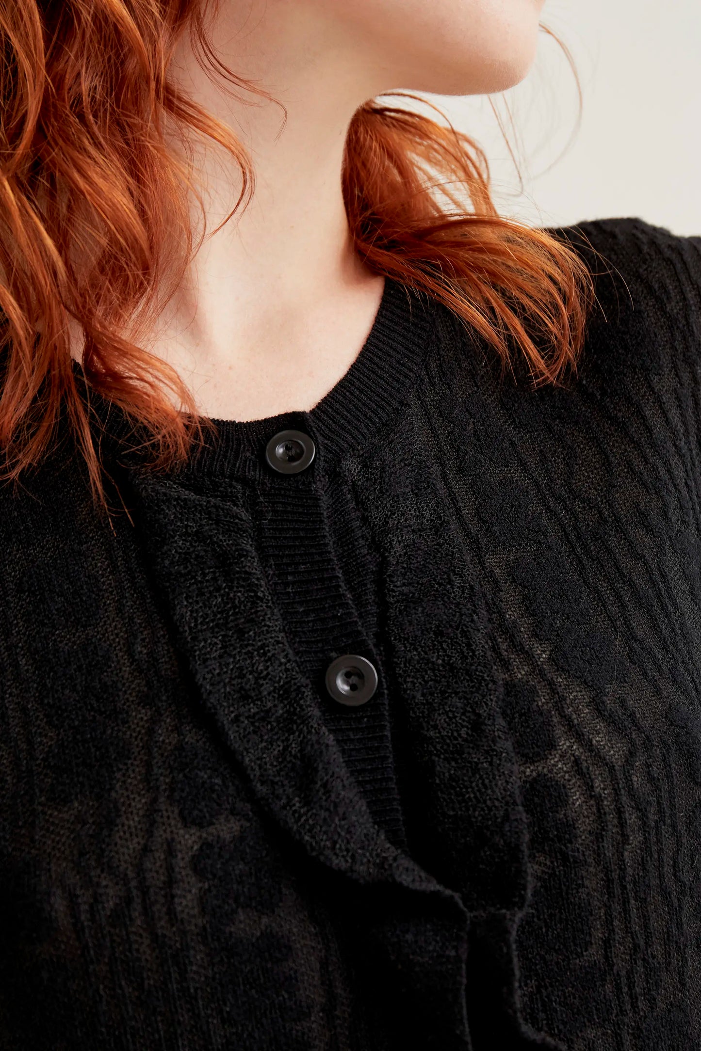 Black floral knit cardigan with ruffles