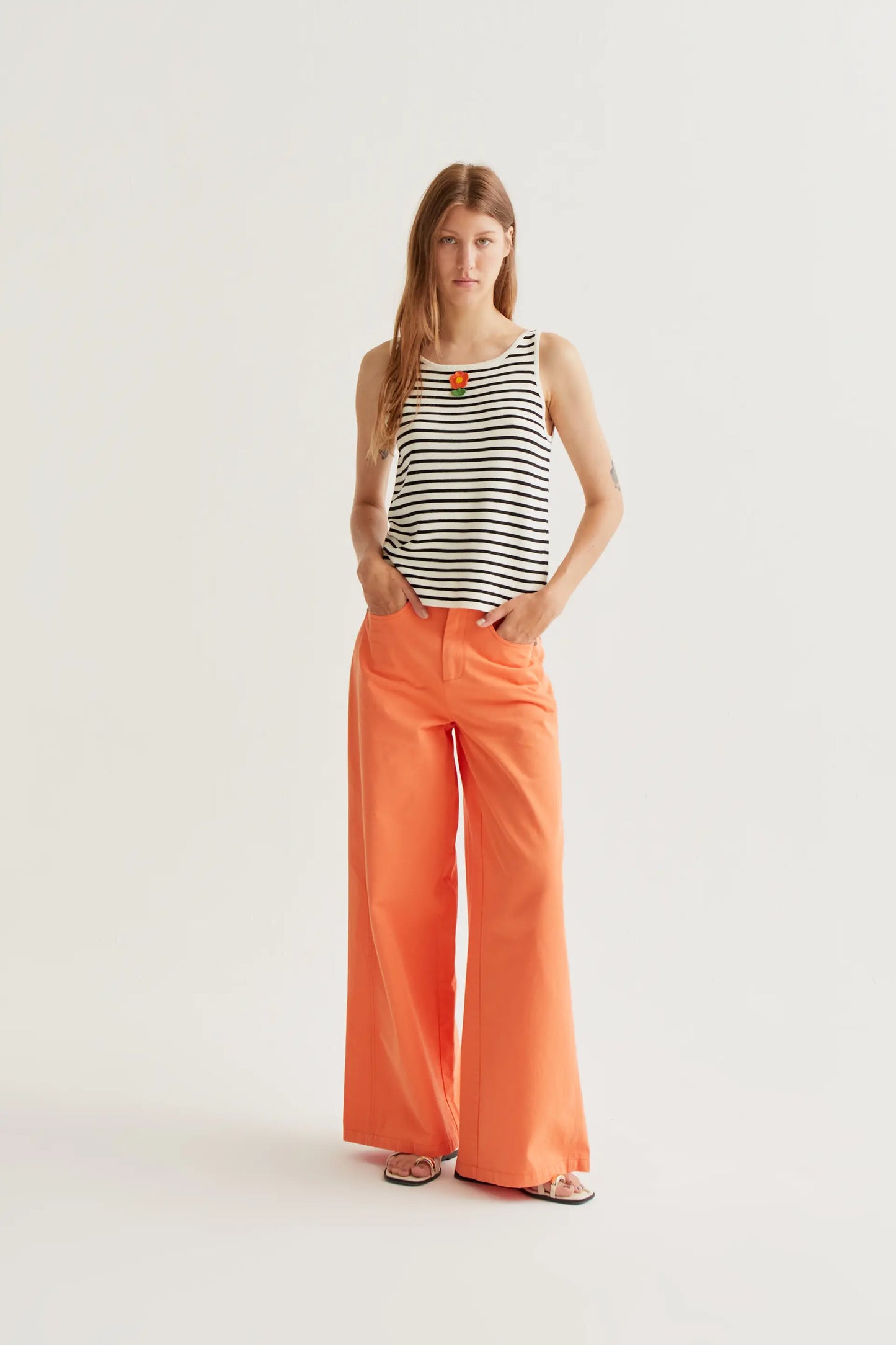 Black and white striped top with floral embroidery