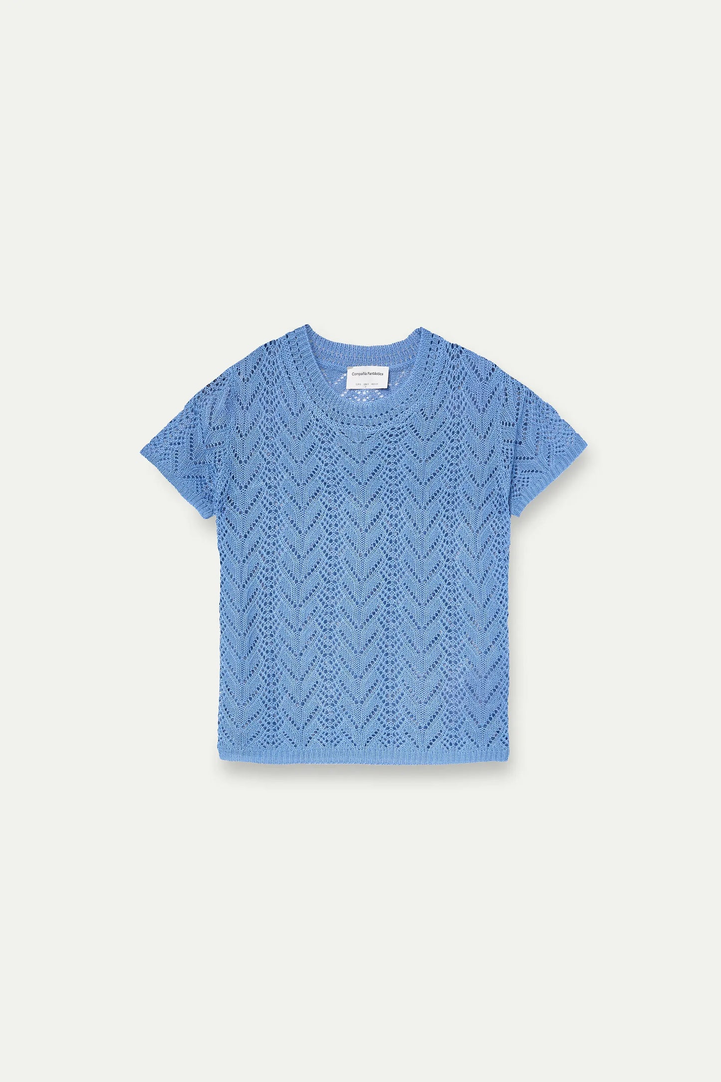 Top traforato azzurro chiaro ricamato a forma di fiore