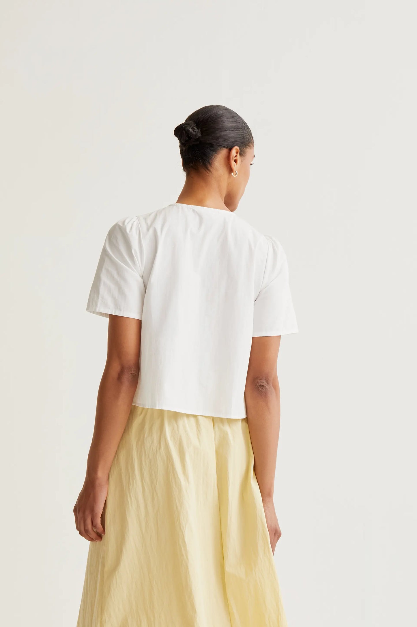 Top 100% cotone con bottoni multicolori