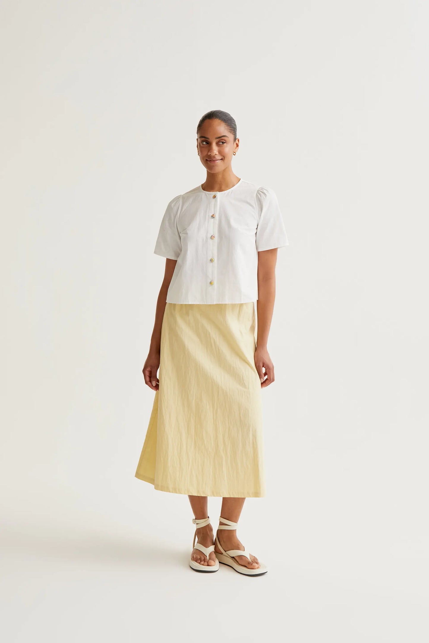 Top 100% cotone con bottoni multicolori