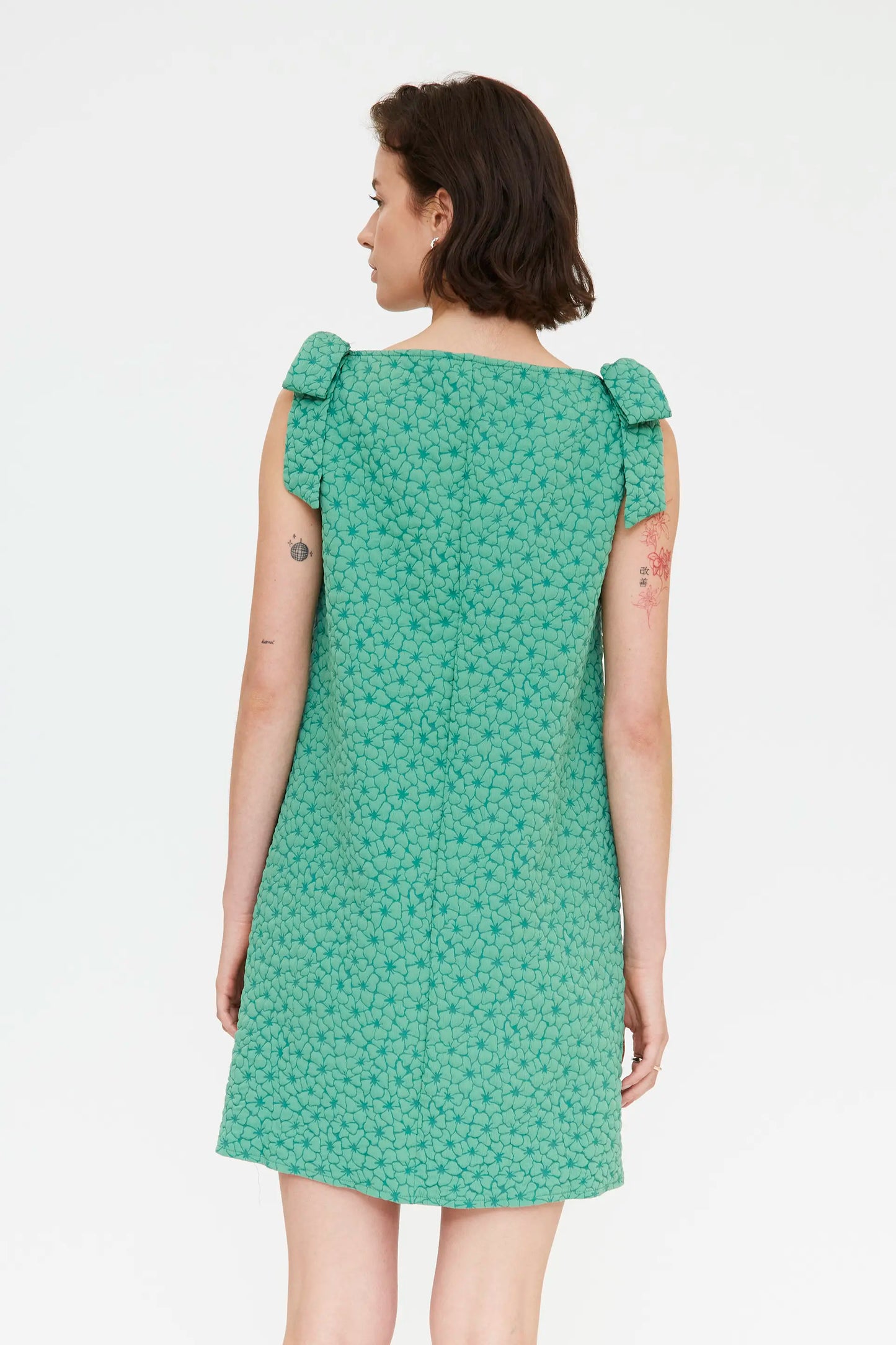 Short green dress with floral texture