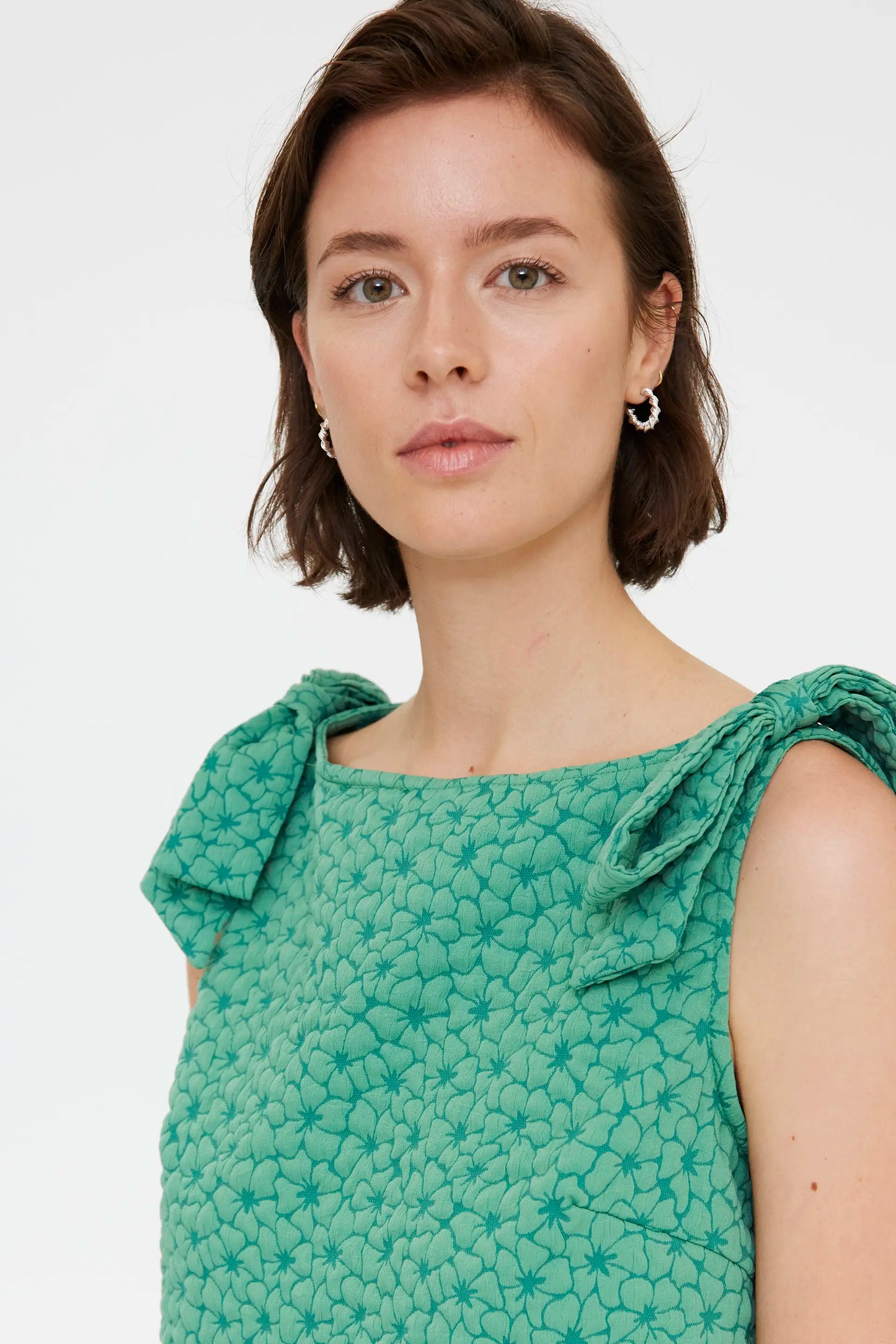 Short green dress with floral texture