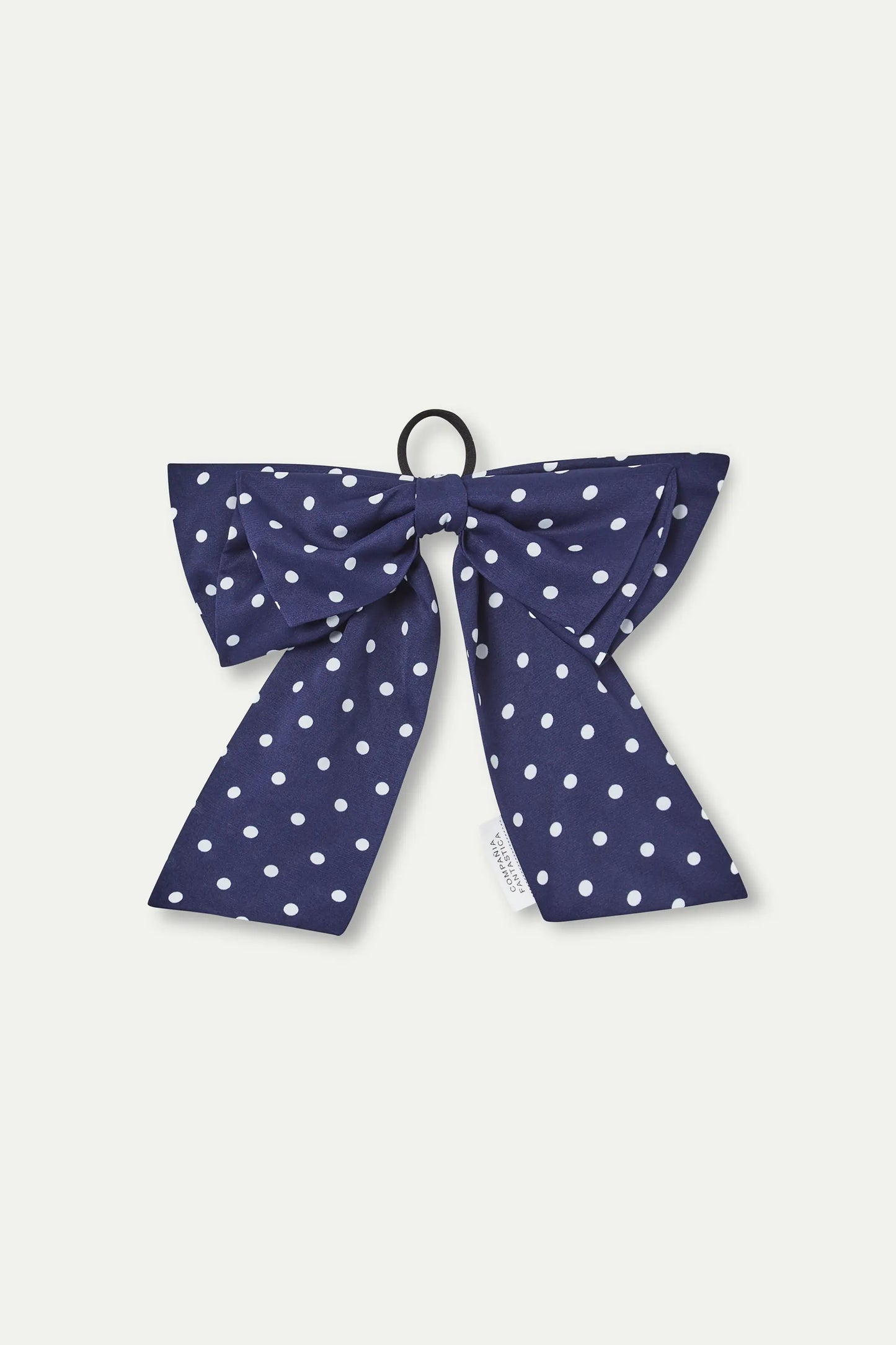 Navy blue bow scrunchie with white mini polka dot print