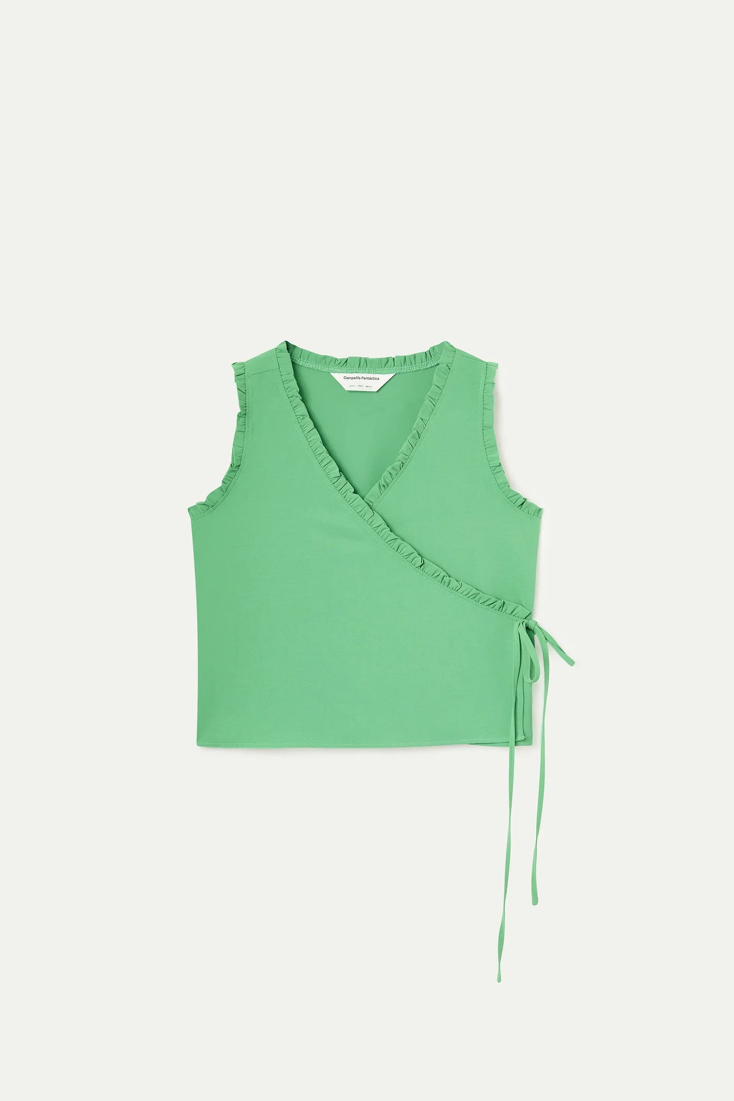 Top verde con scollo a V