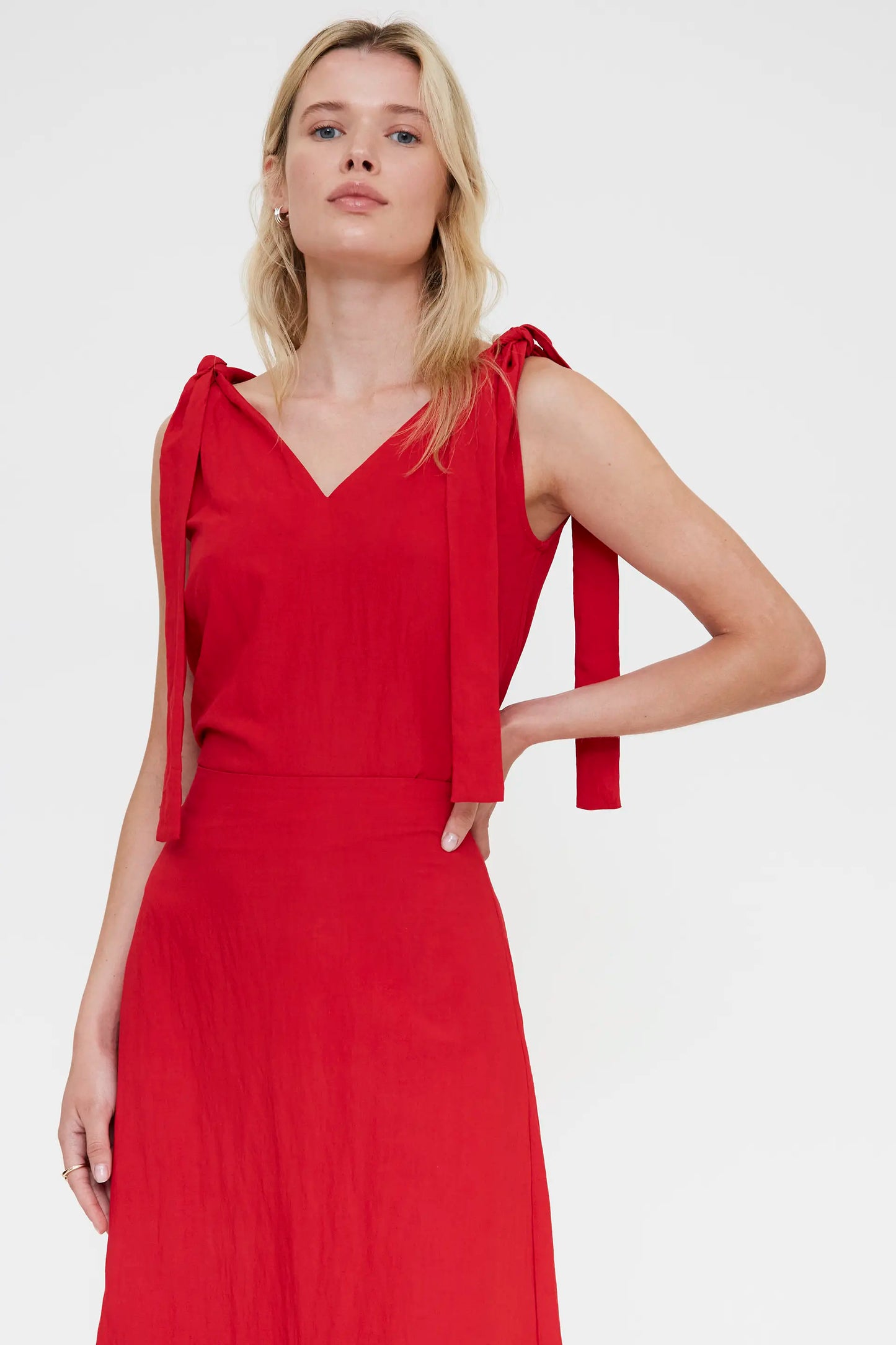 Red asymmetric top with a V-neck