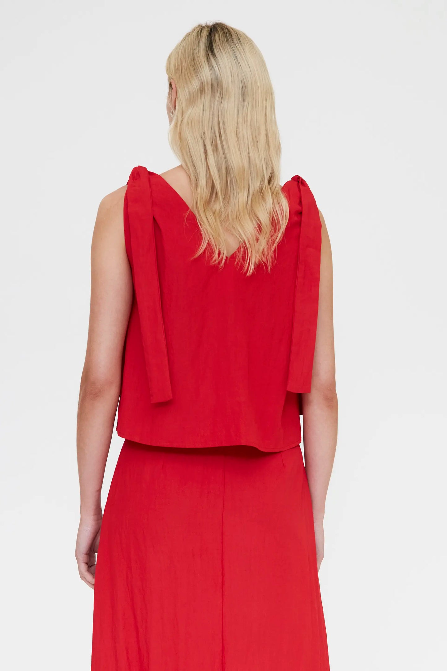 Red asymmetric top with a V-neck