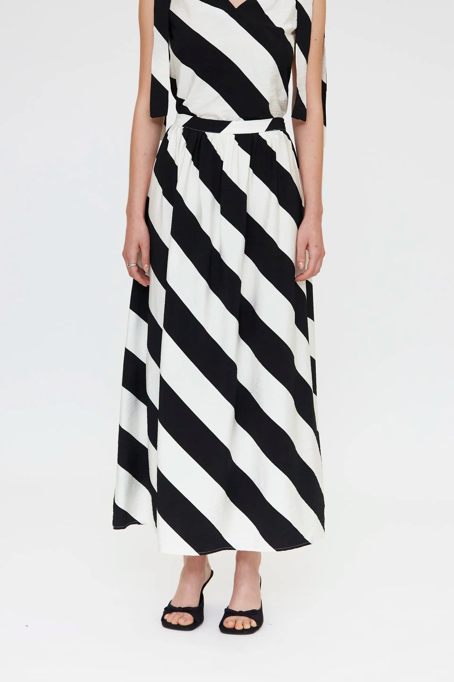 Long skirt with black and white diagonal striped print