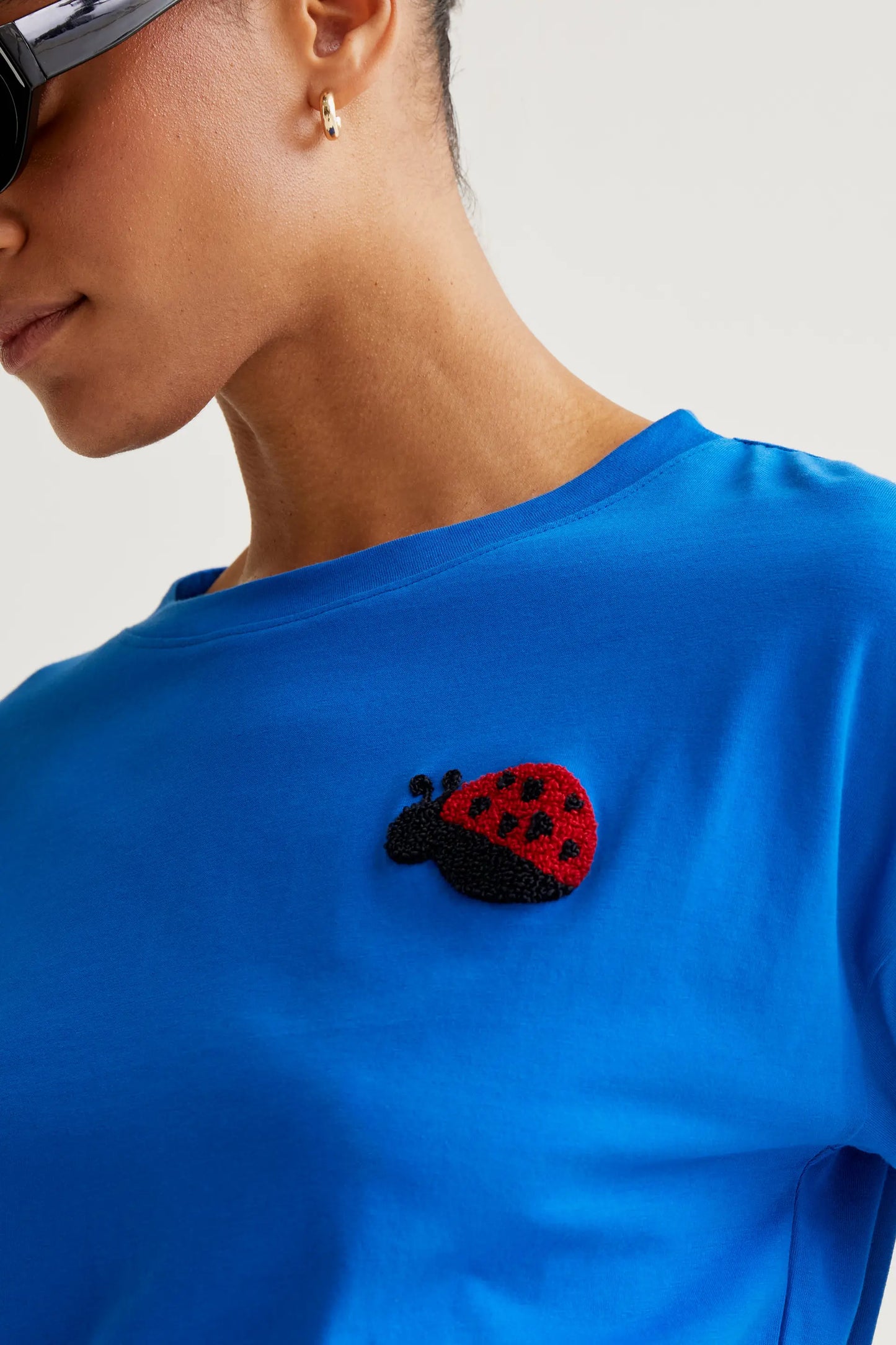 Blue t-shirt with Coccinellidae embroidery