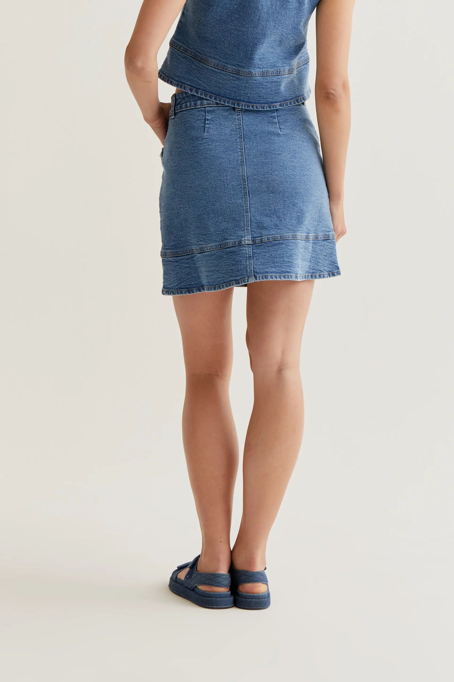 Blue denim skirt with ruffle detail