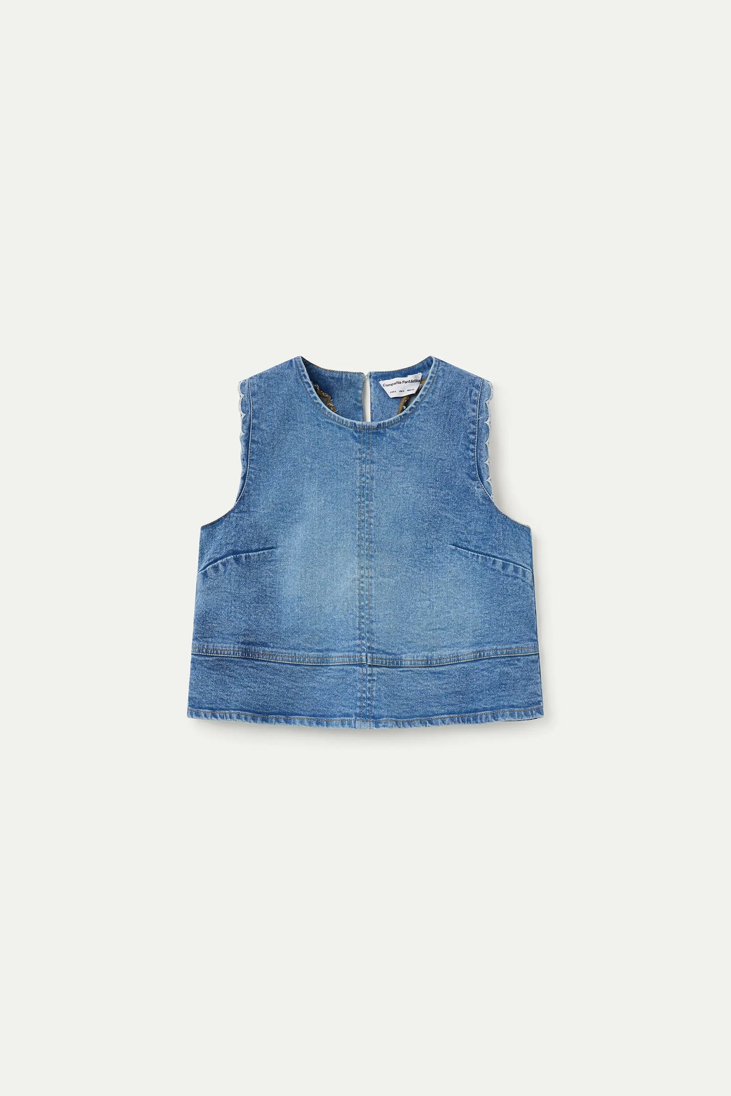 Top in denim blu con dettagli ondulati