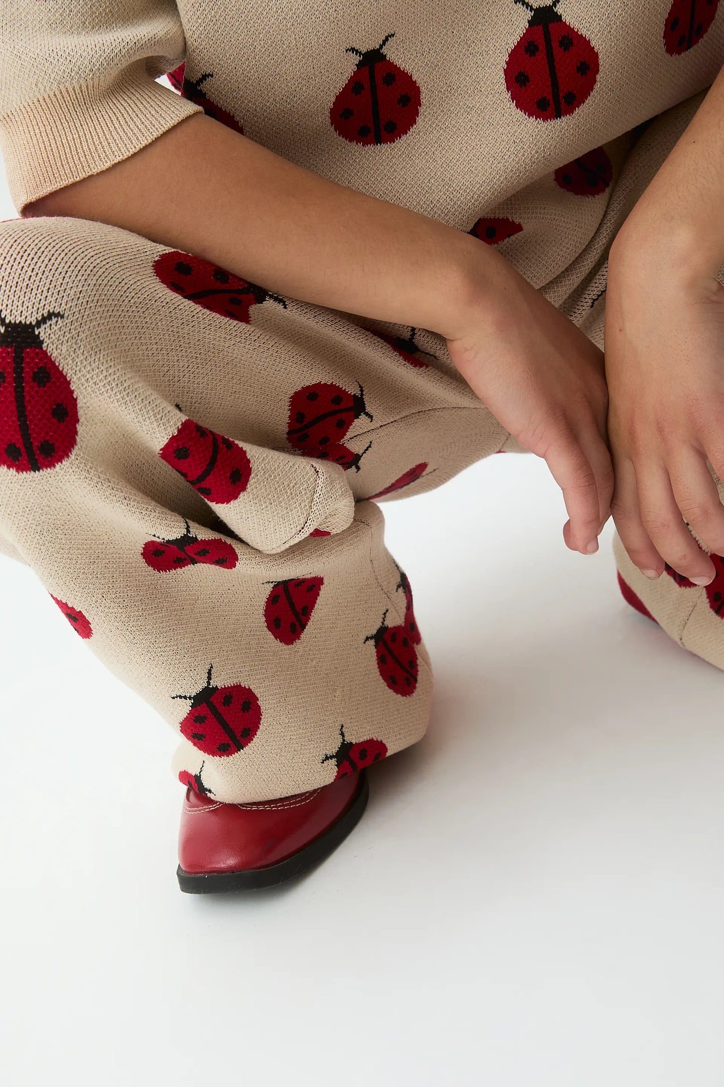 Girls' jacquard knit trousers with Red Coccinella print