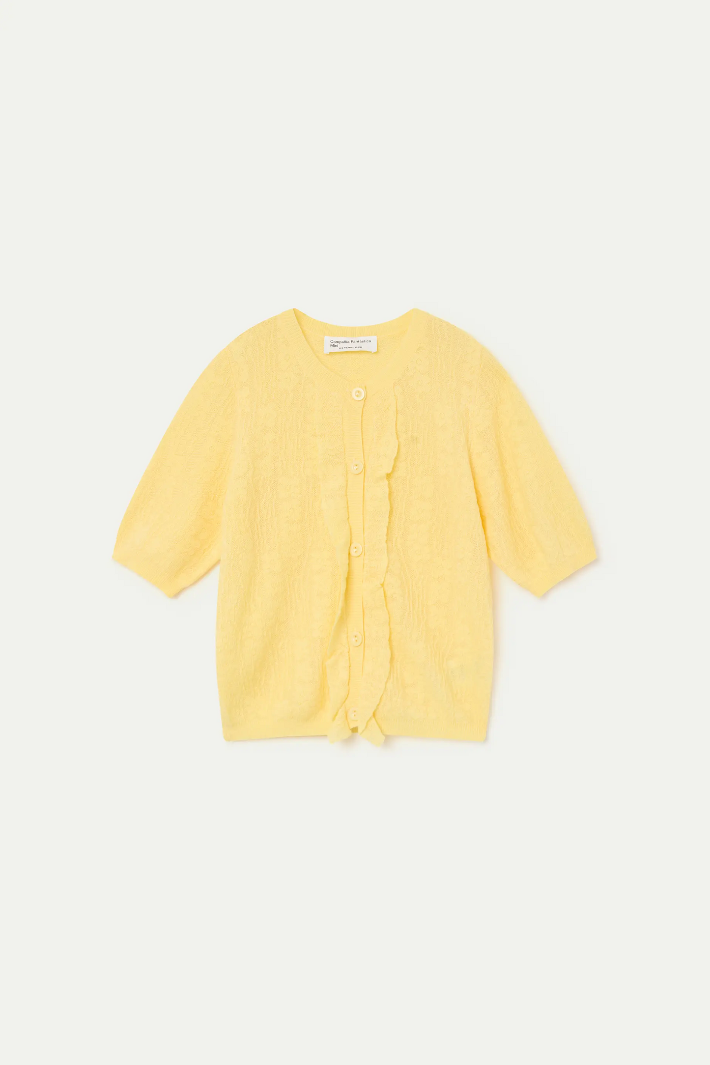 Cardigan giallo in maglia da bambina