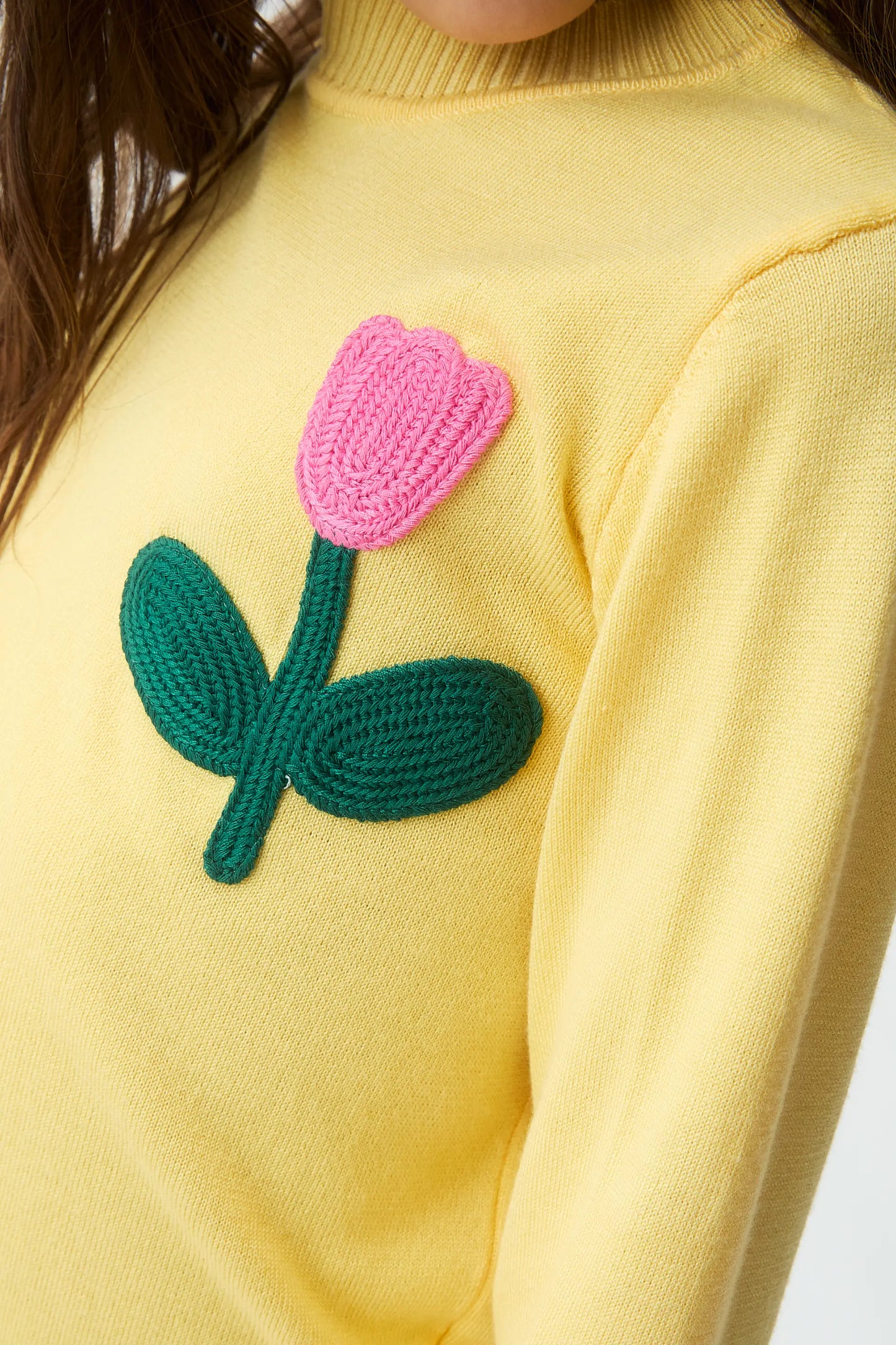 Girl's knitted sweater with flower embroidery
