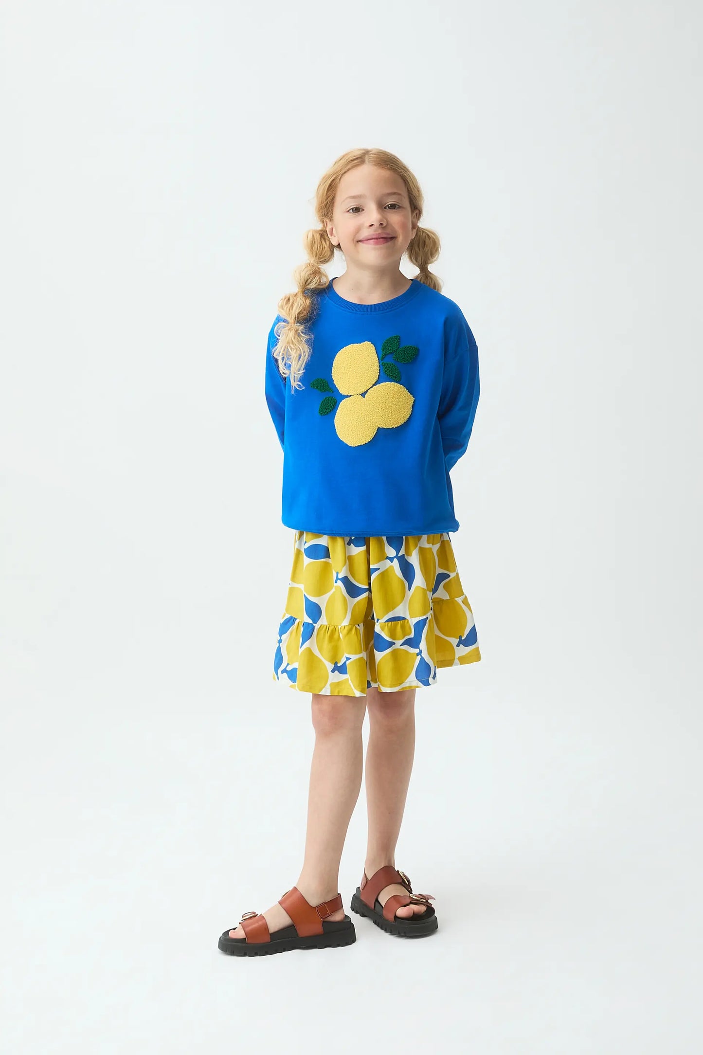 Felpa blu da bambina con toppa a forma di limone