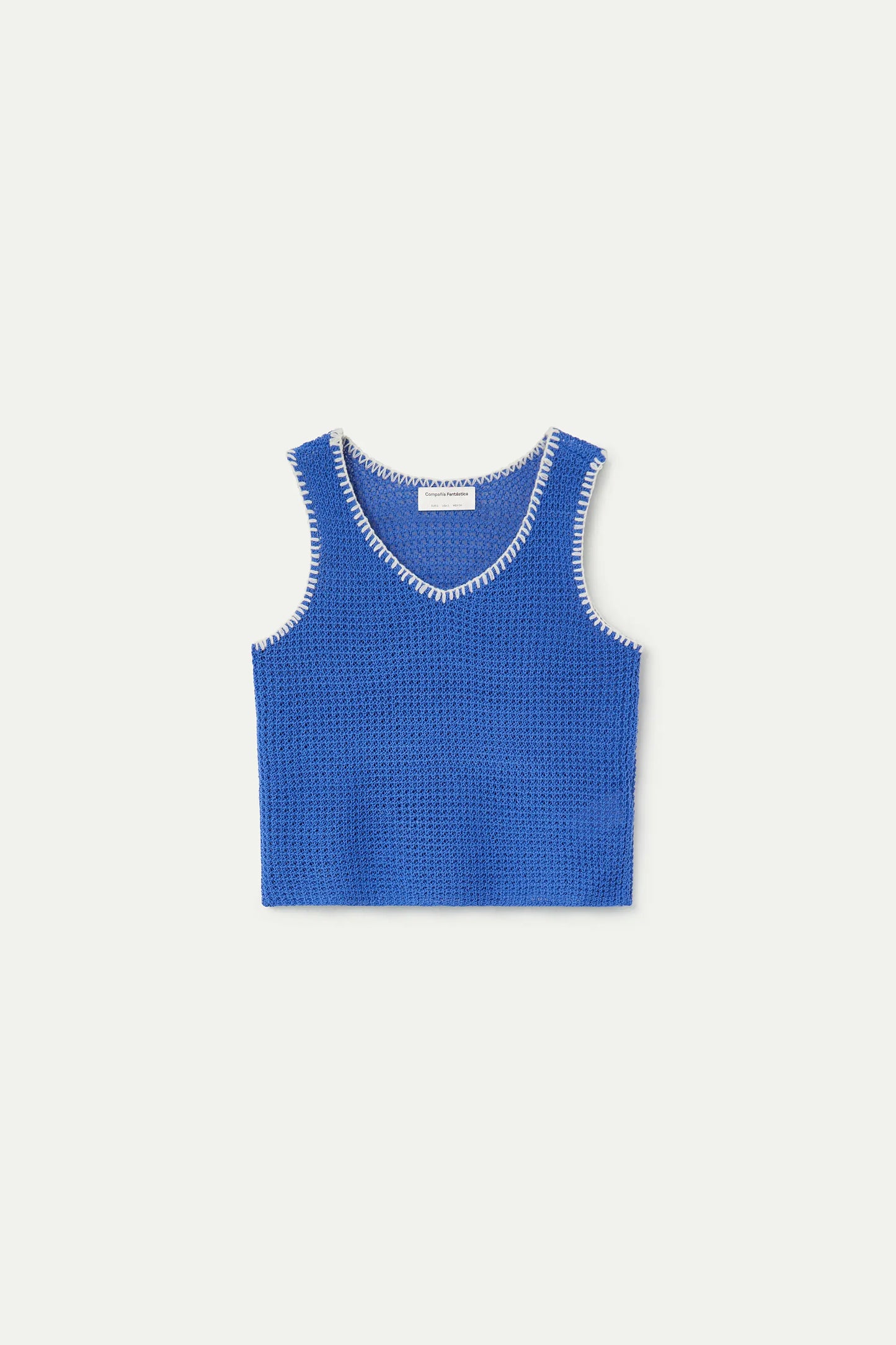 Top in maglia traforata blu con dettagli ricamati bianchi