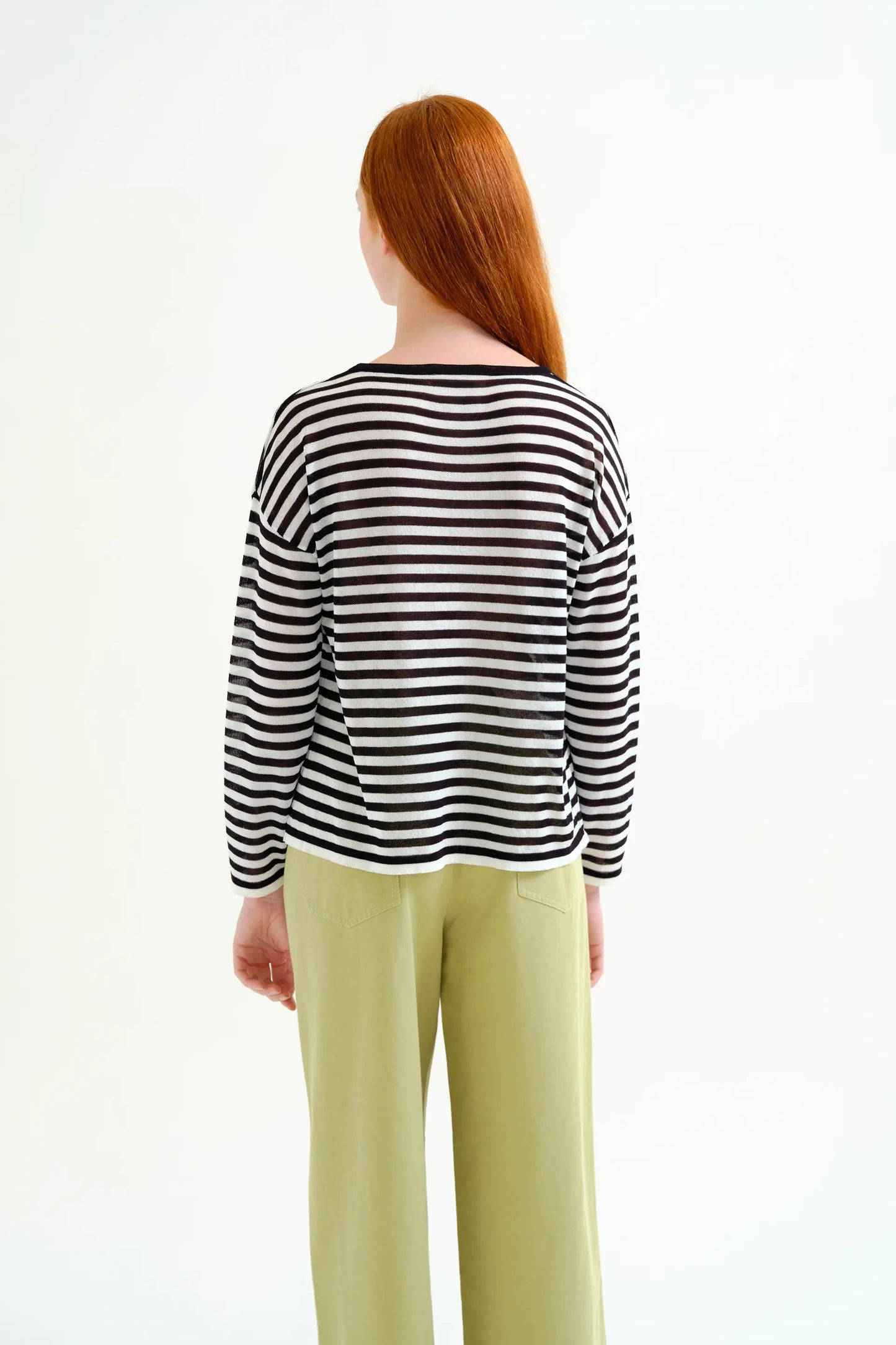 Soft knit sweater with black and white striped print