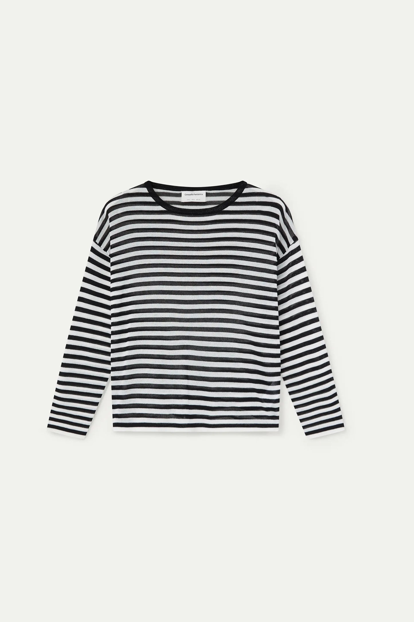 Soft knit sweater with black and white striped print