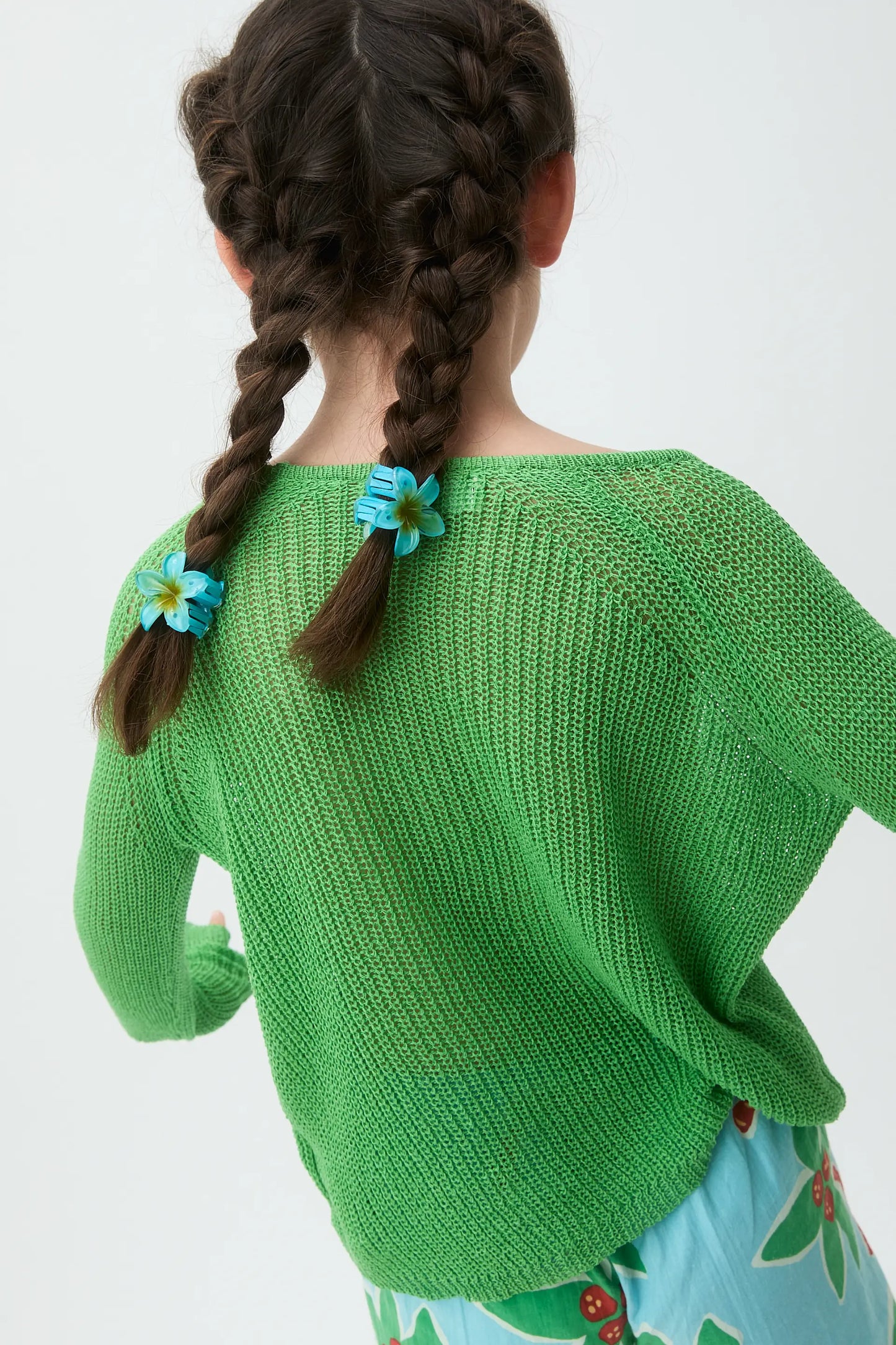 Girl's long-sleeved green knit sweater
