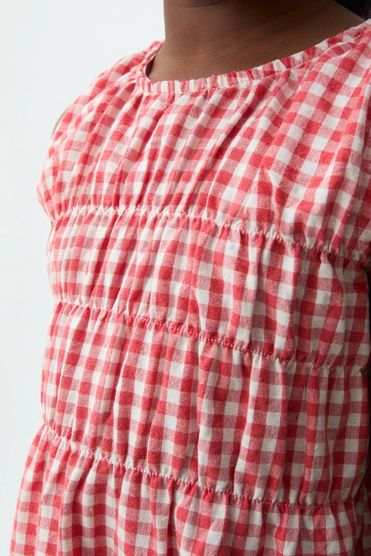 Abito corto per bambina con stampa a quadretti rossi