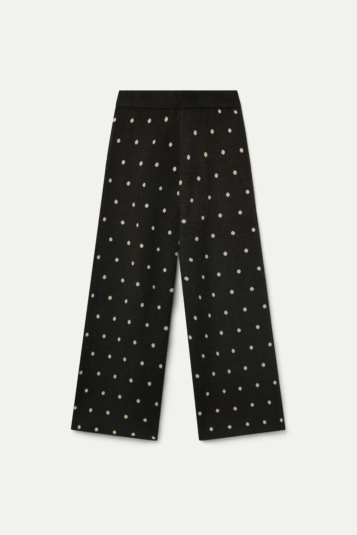 Pantaloni verdi con stampa a pois bianchi piccoli