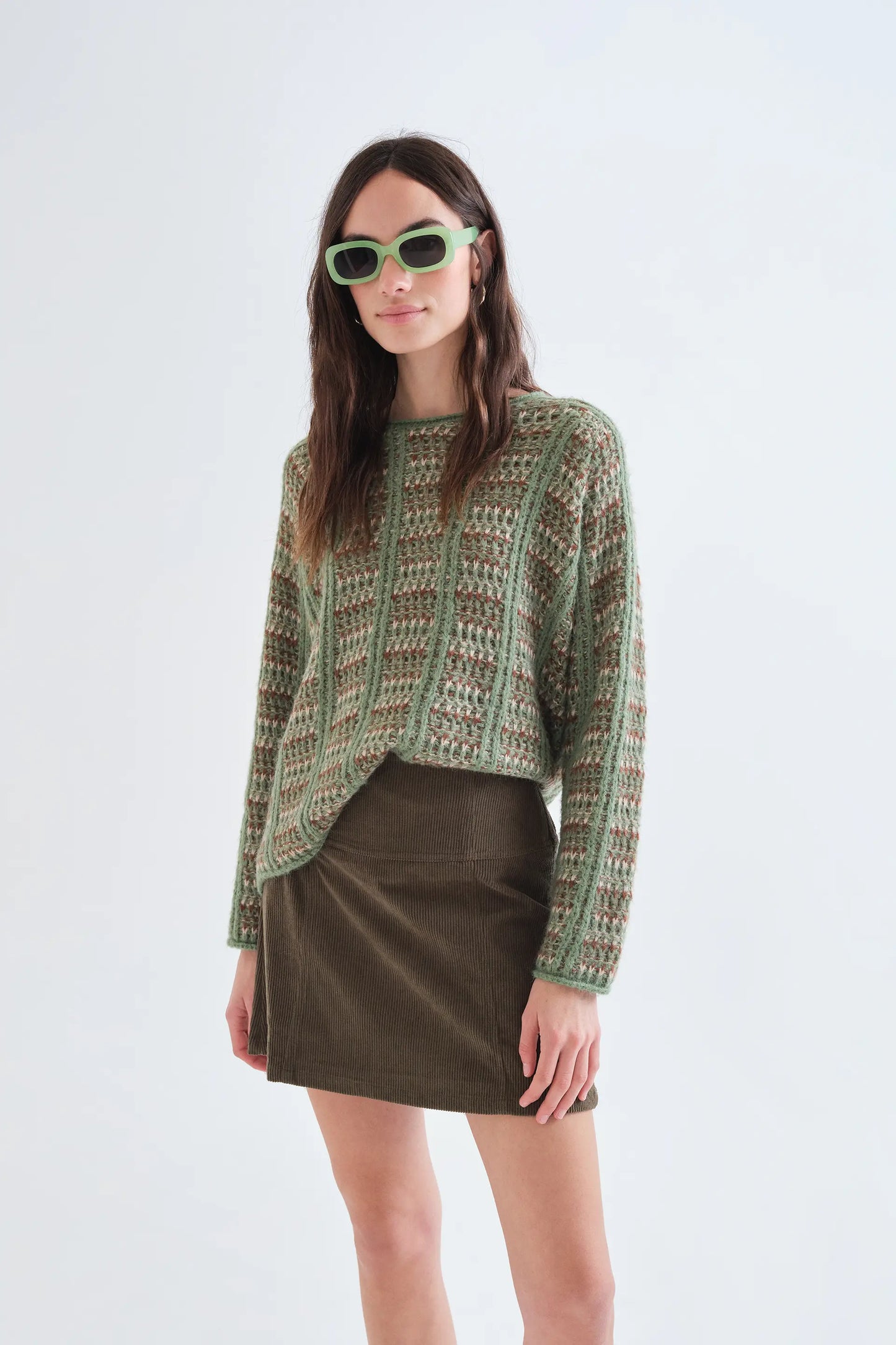 Green knitted jumper with embroidered details