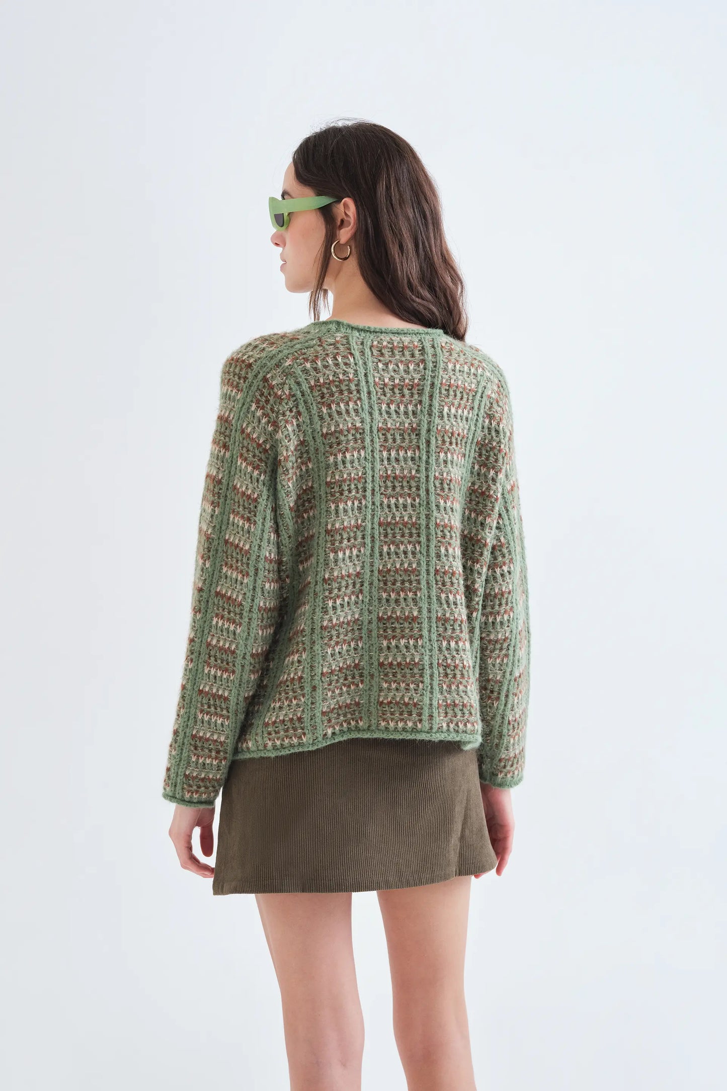 Green knitted jumper with embroidered details