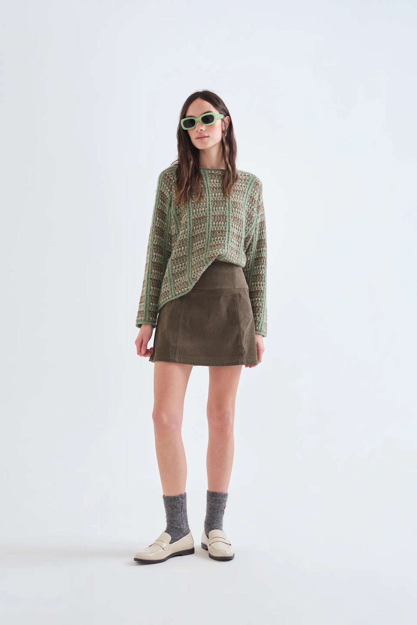 Green knitted jumper with embroidered details