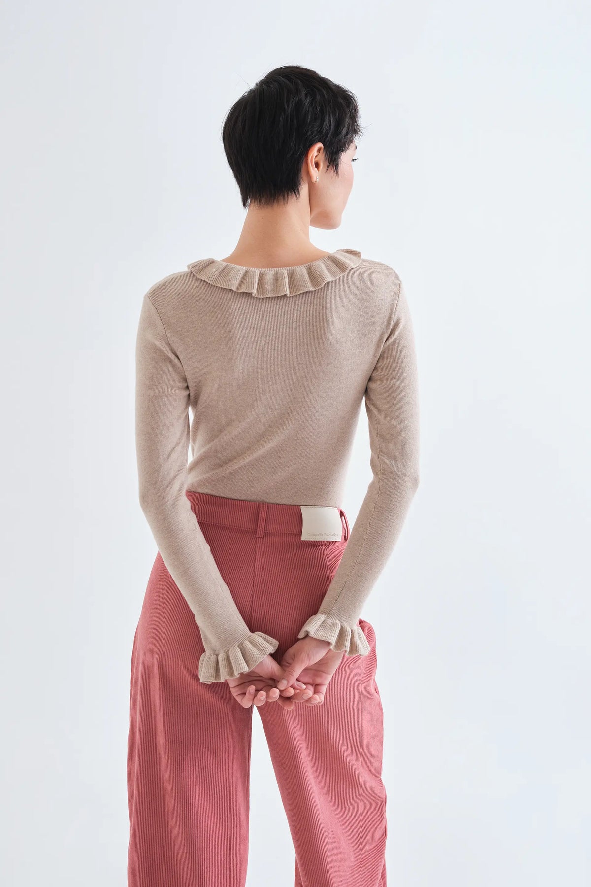 Top con volant in maglia beige