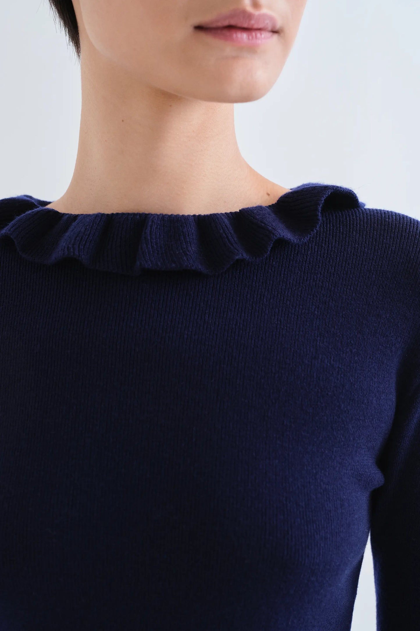Navy blue knit ruffle top