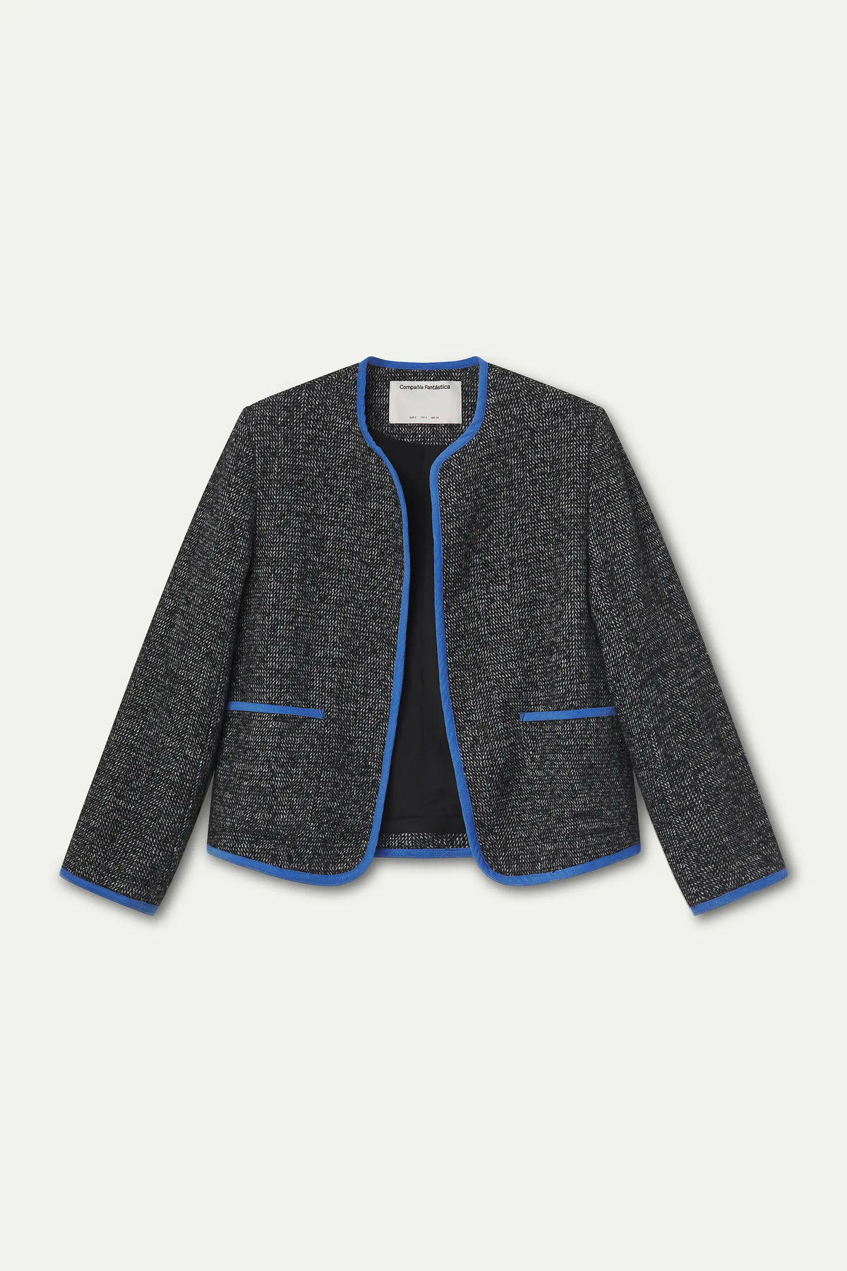 Chaqueta tweed negra con detalles azul claro